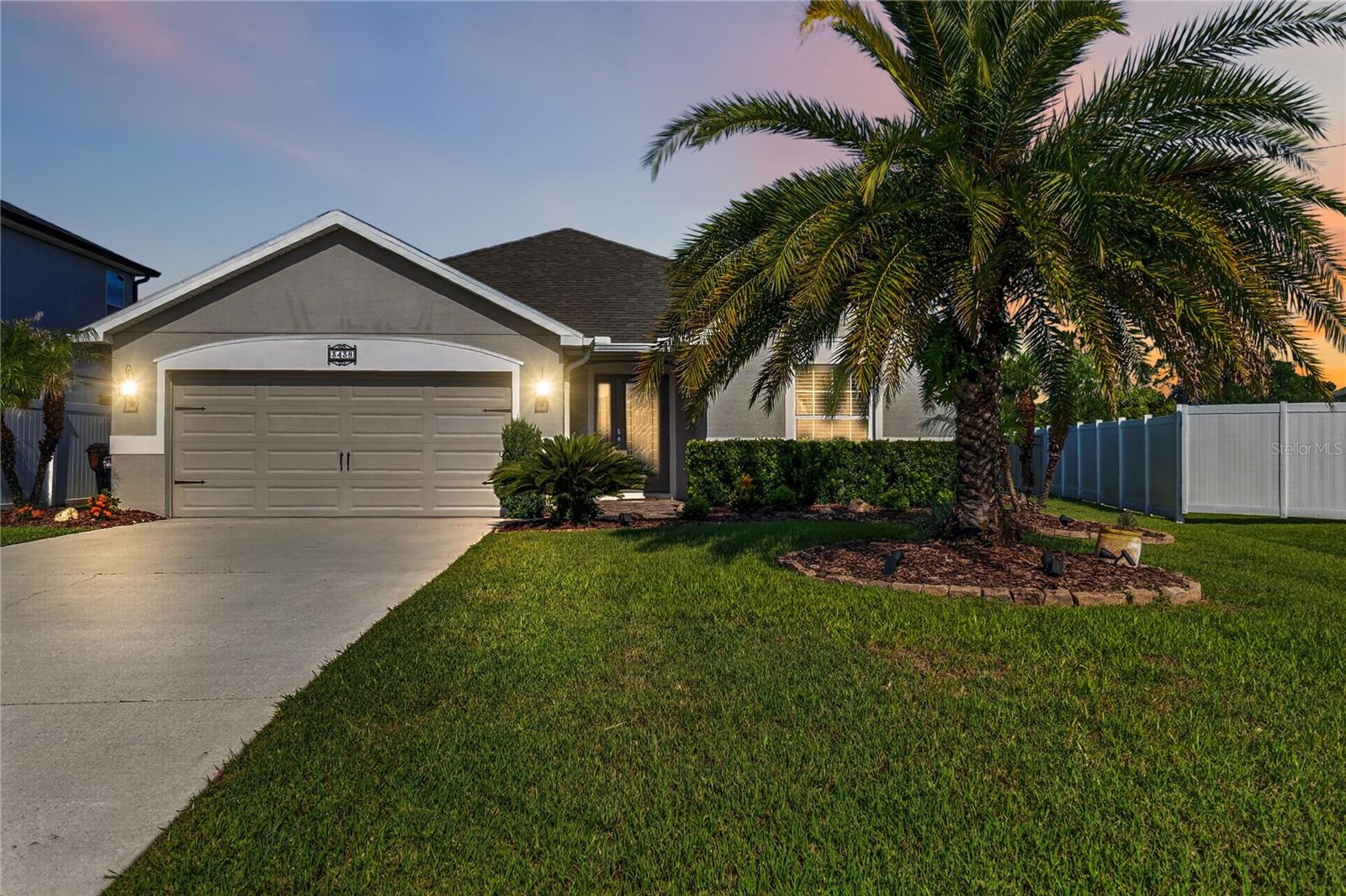 Better Than New! Stunning Waterfront Home in Canopy Reserve – St. Cloud. Welcome to 3438 Barina Street, an exceptional Highland Homes Serendipity floor plan offering 3 bedrooms, 2 bathrooms, perfectly blending luxury, comfort, and functionality. Nestled on one of the premier waterfront lots in the intimate Canopy Reserve community, this meticulously maintained home is truly move-in ready. From the moment you arrive, you'll be impressed by the beautifully landscaped oversized homesite and outstanding curb appeal. Step through the custom front door into a welcoming foyer featuring elegant wainscoting, crown molding, and thoughtful designer upgrades throughout. The open-concept layout is ideal for both everyday living and entertaining. The spacious gathering room flows seamlessly into the sunny dining area and a chef-inspired kitchen complete with a large counter-height island, walk-in pantry, abundant cabinetry, and premium finishes, ensuring you're always part of the conversation. The private owner's suite serves as a relaxing retreat with a tray ceiling, tranquil water views, dual walk-in closets, and a luxurious en-suite bath featuring dual vanities and a spacious walk-in shower. A desirable split-bedroom floor plan provides privacy for family and guests, while the flexible den offers the perfect space for a home office, media room, or playroom. Additional features include volume ceilings, a dedicated laundry room, convenient drop zone at the garage entry, dual-sink guest bathroom, covered front porch, and a covered lanai overlooking the peaceful community pond. The fully fenced backyard with elegant iron fencing maximizes the beautiful waterfront views and creates the perfect setting for morning coffee or evening sunsets. Located in one of St. Cloud's most desirable boutique communities, Canopy Reserve offers a peaceful atmosphere with low HOA fees while remaining just minutes from Downtown St. Cloud, East Lake Tohopekaliga, Lake Nona Medical City, shopping, restaurants, farmers markets, major highways, Orlando International Airport, and Central Florida's world-famous attractions. If you've been searching for a home that's truly better than new, with premium upgrades, an exceptional homesite, and impeccable condition, your search ends here. Schedule your private showing today and experience everything this remarkable home has to offer.
