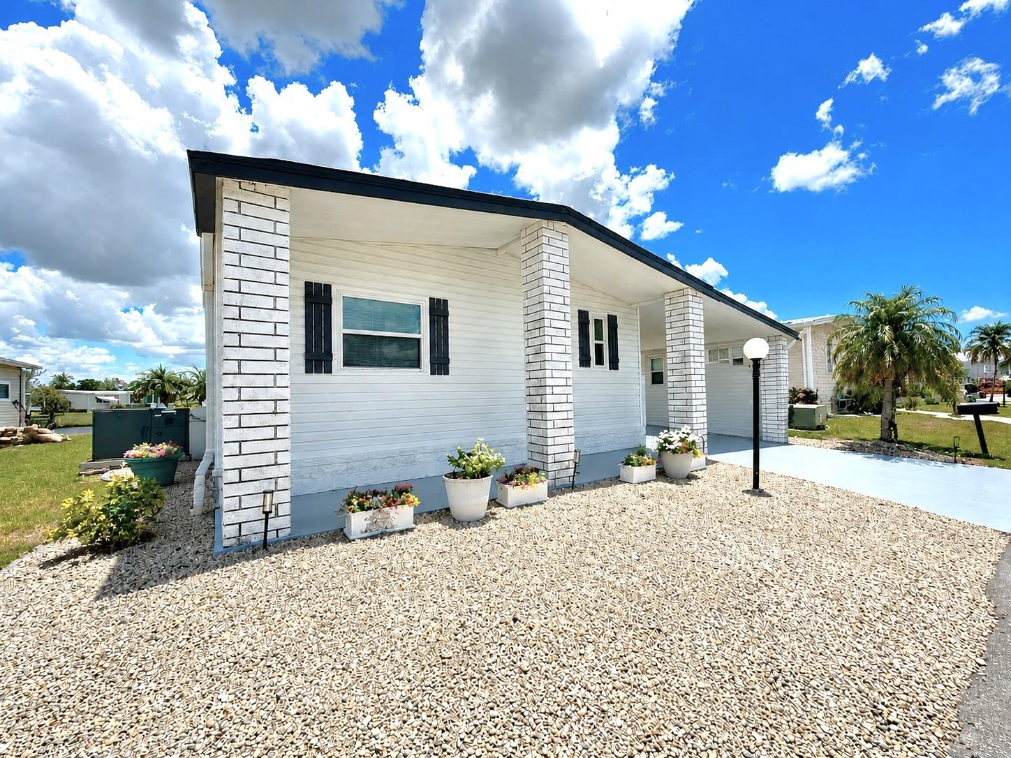 Fall in love w/ this beautifully maintained & thoughtfully **UPGRADED 2/2 TURNKEY WATERFRONT** coastal style home, ideally positioned to showcase long, peaceful views of Cayman Lake. Life at Lazy River Village is all about enjoying exceptional amenities w/ access to the Myakka River. This vibrant community truly has a resort-style lifestyle, and by far, the **MOST PREMIER RESIDENT-OWNED 55+ gated communities in the area!** Here, every day feels like a getaway, w/ endless opportunities to relax & enjoy the Florida lifestyle from day one. This home offers separate living & dining areas, both positioned to capture relaxing views of the lake, creating a welcoming atmosphere throughout the main living spaces. The kitchen is designed w/ both functionality & entertaining in mind, complete w/ a convenient breakfast bar, stylish backsplash, stainless steel appliances, an abundance of cabinets & an open layout that flows seamlessly into the spacious family room—perfect for hosting gatherings, enjoying family time, or simply relaxing at the end of the day.  The oversized primary suite offers comfort & convenience, highlighted by an exceptionally large walk-in closet w/ plenty of room for storage, organization, or even the potential for additional custom-built ins. The en-suite bathroom has a shower w/ sliding glass door, large vanity & a linen closet. The guest bedroom doesn’t disappoint & provides a generous amount of room for your guests w/ an extended wall-to-wall closet & a guest bath w/ a shower/tub combo. Enjoy peaceful lake views from the bright & inviting back Florida room lined w/ sliding windows that allow you to take full advantage of the natural light & beautiful waterfront scenery year-round. But wait, there’s more! This home features an impressive 23-foot-long enclosed lanai/Florida room w/ sliding windows & French doors that open directly toward the lake! Whether you're sipping your morning coffee or enjoying Florida’s gorgeous sunsets, this versatile space is sure to become a favorite retreat. The Florida room also provides direct access to the oversized workshop & a dedicated laundry room, adding even more convenience and functionality to this already exceptional home. For just $276 a month, the HOA includes lawn care, cable, Wi-Fi & access to an impressive collection of amenities. There is also a convenient on-site storage available for your boat or RV for an additional fee. Enjoy sunny afternoons at the heated pool & spa, launch your next adventure from the private marina & boat ramps, or stay active w/ pickleball, tennis, bocce, shuffleboard & a putting green. The clubhouse is equally inviting, offering game rooms, a library, craft spaces & a fitness center, while a lively calendar of music, yoga, aqua-fit, stained glass & social gatherings make it easy to fill your days & form lasting friendships. When you’re ready to explore, Gulf Coast beaches are just 20 minutes away, while the charming downtowns of North Port, Venice, Sarasota, and Punta Gorda offer endless dining, shopping, and entertainment. Sports enthusiasts will love being near Wellen Park, CoolToday Park—spring training home of the Atlanta Braves & the nearby Tampa Bay Rays spring training facility. Quick access to I-75 & several major airports. Whether you’re searching for a year-round home or the perfect seasonal retreat, this property offers a lifestyle filled w/ sunshine, convenience & the laid-back charm that makes Florida living so special.