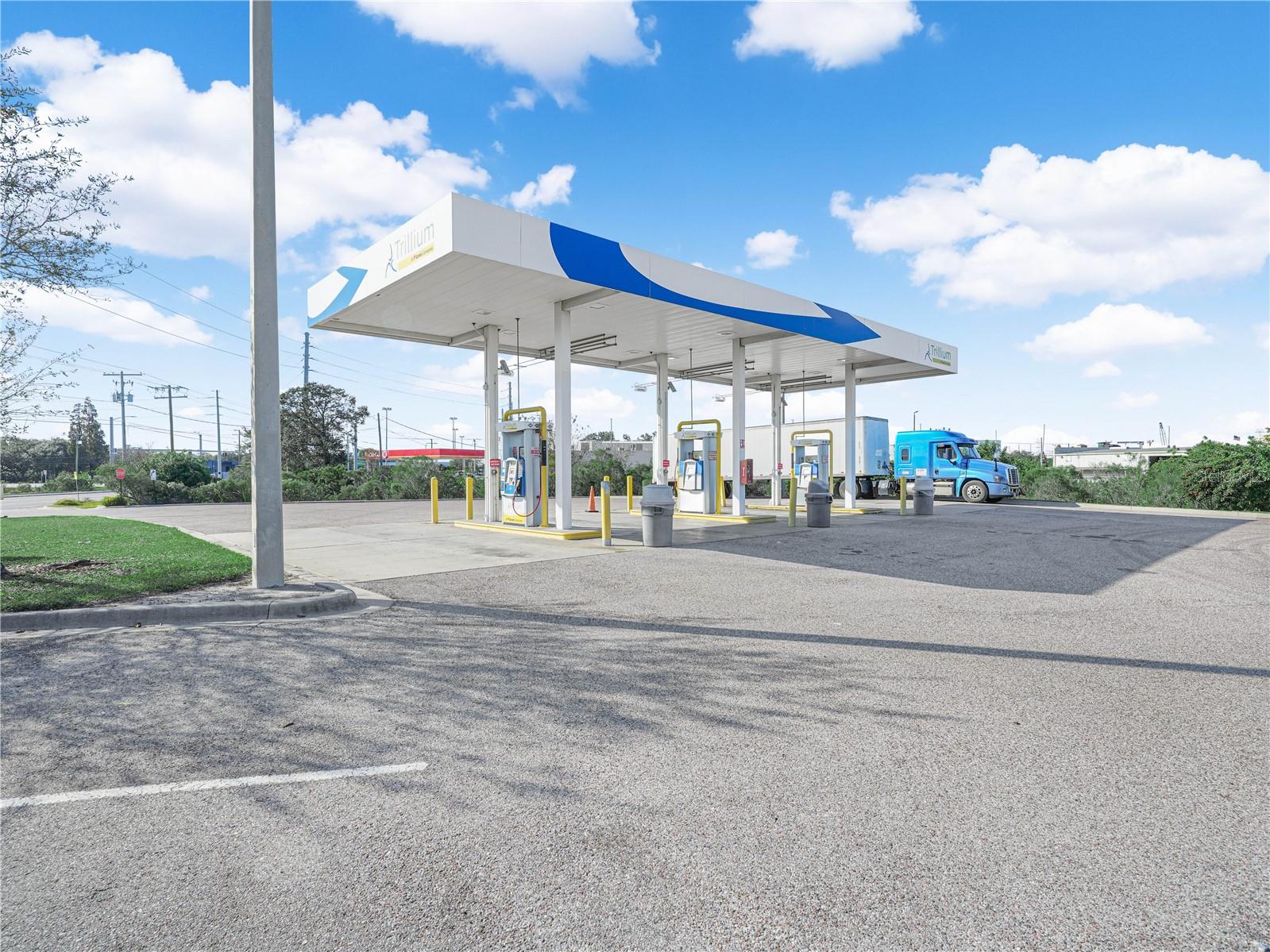 Located at the corner of Madison Avenue and US 41 / Tamiami Trail in Tampa, Florida, this ±3.4-acre site features six Trillium Fuel pumps offering compressed natural gas (CNG), hydrogen, and electric vehicle (EV) charging, making it a unique alternative-energy and redevelopment opportunity.

The property benefits from three premium access points, including a long primary driveway from US 41 and two additional access points directly off the Madison Avenue corridor. This configuration allows for excellent circulation and accommodates all vehicle types, including semi-trucks.

Strategically positioned behind a Circle K, the site enjoys strong visibility and convenient accessibility from US 41 while benefiting from traffic generated by a major national retailer.

Situated in Hillsborough County, the property lies within a heavily industrial corridor just minutes from Hillsborough Bay, with nearby canal access serving major users such as CEMEX, TECO, and other industrial operators, further enhancing the site’s logistical appeal.

The site’s Manufacturing zoning allows for a broad range of potential uses, including continued operation or redevelopment as a convenience store or fuel facility, as well as alternative uses such as body shop, lawn care operations, vehicle repair, warehouse, hospital, or medical office. This flexibility makes the property well-suited for investors, developers, or owner-users seeking a highly accessible industrial-commercial location.

**All information provided regarding the potential or intended use of the property is for illustrative and informational purposes only. The Seller/Landlord and their agents make no warranties or representations regarding the accuracy, completeness, or suitability of any suggested use, nor do they guarantee that the property is currently zoned for a specific intended use.
