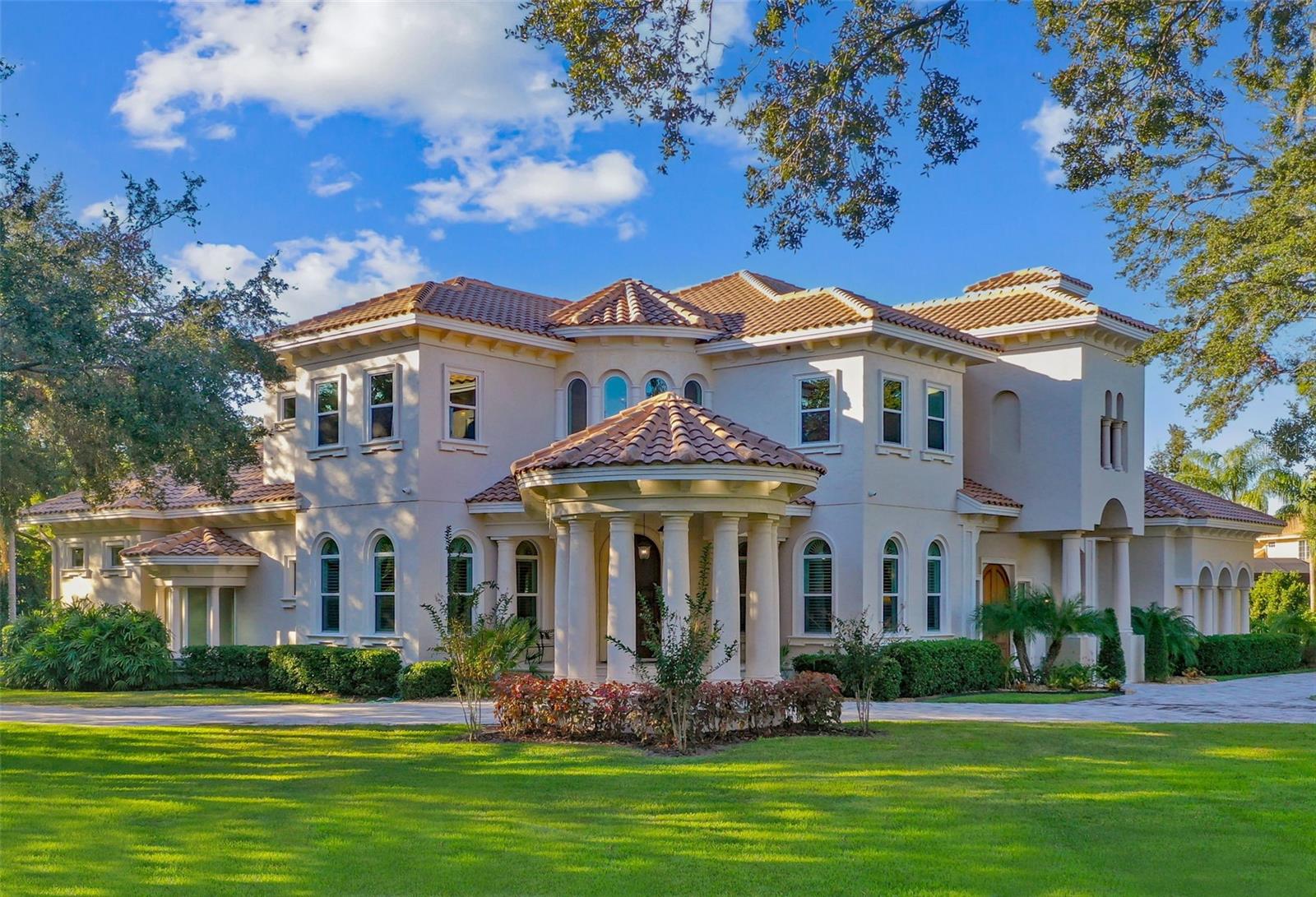 Villa Harmony in Avila Golf and Country Club, Tampa Bay's most exclusive 24/7 guard-gated community. This Mediterranean estate is a masterpiece of luxury and tranquility. Fully renovated in 2022, it seamlessly blends timeless elegance with modern sophistication. The double-height family room opens to a custom-built kitchen with solid cherry cabinetry and quartz countertops, while gleaming Diana Royale marble floors enhance the home's serene ambiance, ideal for displaying your art collection. Designed for entertaining, this home includes a billiards room, video lounge and a wine cellar accommodating over 2,000 bottles. The executive office, with coffered ceilings and a stately gas fireplace, exudes sophistication. The in-law suite, functioning as a fitness center, includes a laundry area, kitchenette and private entry. The third floor offers a full suite that doubles as a relaxation lounge. A centrally located elevator provides easy access to a gift-wrapping room, bonus TV area and three spacious suites. The luxurious owner's retreat features double dressing rooms with cedar-lined cherry cabinetry, a custom breakfast station and bespoke finishes throughout. Outdoors, enjoy a pristine pool area, outdoor kitchen, covered patio and ample gardens, all in a fully fenced property with three automatic gates for privacy. This extraordinary residence has been thoughtfully updated with top-of-the-line finishes, including a new roof, air-conditioning systems, impact windows and doors, designer lighting, a whole-house generator and a chef's kitchen with a secondary catering pantry. This is more than a home, it's a lifestyle. Villa Harmony is a rare opportunity. Claim this sanctuary before it's gone.