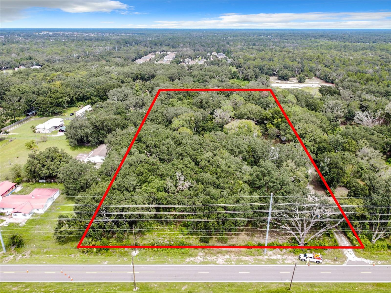 Spanning five acres, this property offers a prime opportunity for land development, RV park, or creating your estate. Being the highest geographic elevation in the county, this land is ideal for those looking to capitalize on growth in the area or build a large home. A land survey is available.