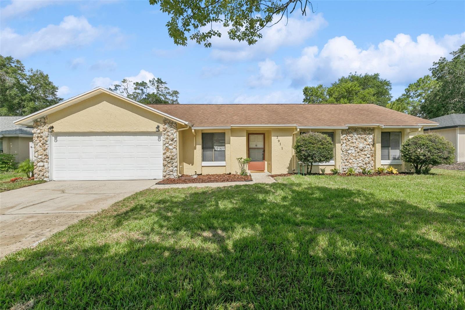 Welcome home to Foxwood, one of the Wekiva area's most established and desirable communities in Seminole County. Perfectly positioned on an oversized quarter-acre homesite, this beautifully updated 3-bedroom, 2-bath pool home combines modern style, everyday comfort, and the Florida lifestyle buyers dream about. From the moment you arrive, you'll appreciate the fresh curb appeal featuring new landscaping, lush St. Augustine sod, and fresh exterior paint. Inside you'll discover a bright, open floor plan designed for both comfortable living and effortless entertaining. Luxury vinyl flooring, fresh interior paint, updated lighting, and thoughtful finishes throughout create a home that feels fresh, welcoming, and truly move-in ready. The showpiece kitchen has been completely transformed with quartz countertops, all-new cabinetry, new stainless steel appliances, new sink, a designer backsplash, abundant workspace, and a pool view. Overlooking the main living areas, it's a space where conversations naturally gather and memories are made. The adjoining living room features a cozy fireplace highlighted by a distinctive wood feature wall, creating a warm focal point filled with character and charm. Open the French doors and discover your own private backyard retreat. The screen-enclosed pool and lanai provide the perfect setting for morning coffee, afternoon swims, weekend barbecues, or simply unwinding after a long day. Decorative inlaid stone pavers and a spacious pool deck offer plenty of room for entertaining, while the oversized backyard provides additional space to play, garden, or relax. The split-bedroom floor plan offers privacy and functionality, with a generous primary suite featuring a private bath, sliding glass doors that open to the pool area, and a convenient built-in exterior-access storage room nearby. Every detail has been thoughtfully updated, allowing the next owner to move in and immediately begin enjoying everything this home has to offer. Located just minutes from shopping, dining, entertainment, healthcare, and major highways including SR 436, SR 429, and SR 414, you'll enjoy easy access to Apopka, Longwood, Altamonte Springs, and the greater Orlando area. Families will appreciate access to highly regarded Wekiva Elementary, Teague Middle School, and Lake Brantley High School. Beautifully updated, exceptionally located, and ready for its next chapter, this Foxwood pool home offers the rare combination of style, comfort, convenience, and value. Schedule your private showing today and see why this one feels like home the moment you walk through the door.