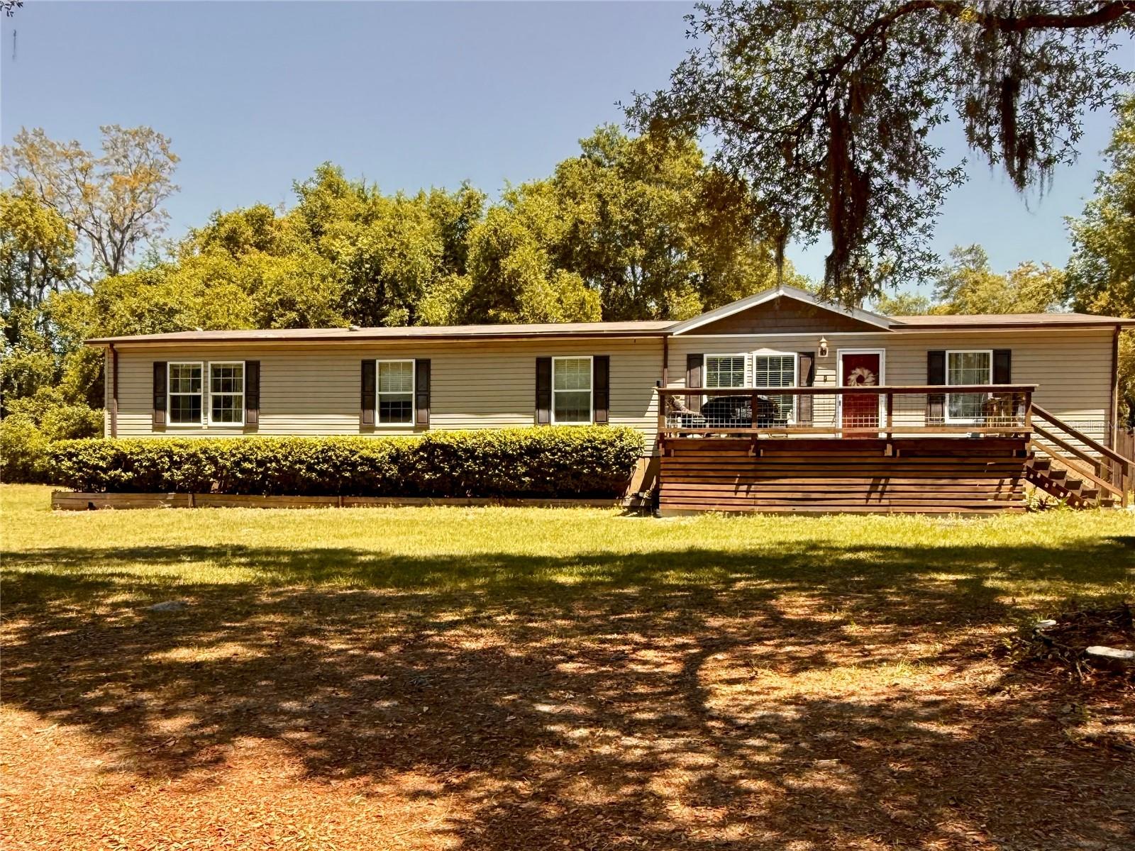 This beautifully maintained, like-new 4-bedroom, 2-bath home sits on 3.38 beautiful acres with 135 feet of frontage on Lake Deon, offering the perfect blend of peaceful privacy and everyday convenience near shopping and dining. With no HOA and A1 zoning, there is plenty of space for animals, as well as your RV, boat, and other recreational vehicles.

Inside, the spacious layout features two separate living areas, a split-bedroom floor plan, a fully equipped kitchen, a wood-burning fireplace, and an upgraded primary suite. Outdoors, you will find a large fenced backyard, a huge detached enclosed gazebo with the potential to become an outdoor kitchen, and a covered workspace that creates endless opportunities to enjoy and customize the property.

Schedule your private showing today and come experience everything this breathtaking property has before it is gone.