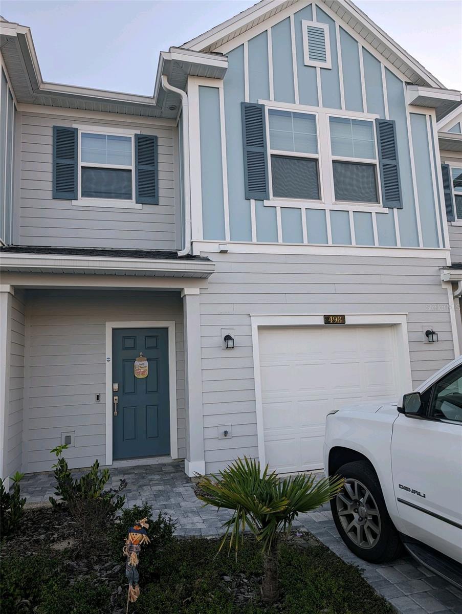 Live the life you've always dreamed of in Northern St. Johns County's premier luxury community of Beachwalk.  This stunning 2 bedroom, 2.5  bathroom townhome is now available and shows like a model.  The homes open and contemporary design is perfect for both relaxing and entertaining.  The main level boasts of beautiful tile flooring leading you into the heart of the home.  The open kitchen is a chiefs delight, featuring deep farm  stainless kitchen sink and stainless steel appliances.  Beautiful quartz countertops offers an array of room for both prepping and functionality.  Adjacent  dining and gathering areas create a seamless flow perfect for hosting friends and family along with a peaceful lanai to enjoy a slight breeze.  Upstairs,  you will encounter the spacious master bedroom complete with a large walk-in closet and spa-like bathroom with double vanities and walk in shower.   A second full bathroom features a full-sized shower and tub with a single vanity.  As a resident , you will receive a privileged Crystal Lagoon  membership granting you access to unparalleled resort style lifestyle..  Enjoy free live music, swim up bar, food trucks , state of the art fitness center,  splash park and tennis courts.  Enjoy everyday convenience of shopping and dining and only minutes away from St. Augustine beaches!  Your new life  awaits you!