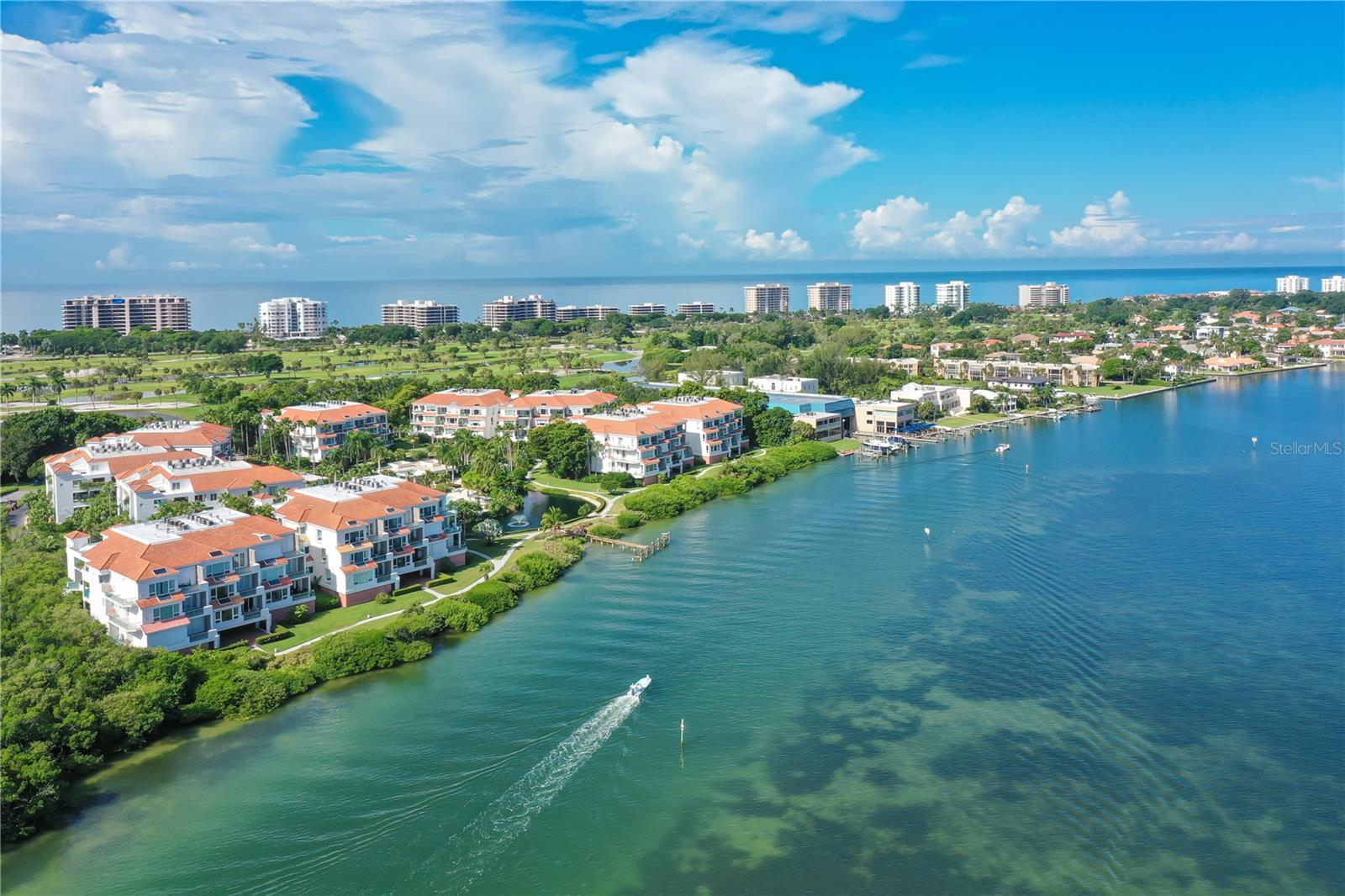 Experience resort-style living at Tangerine Bay Club, a gated sanctuary on the desirable south end of Longboat Key. This impeccably maintained end-unit residence offers 2,400 square feet of refined living space with lush Sarasota Bay views and unmatched proximity to the area’s top attractions.  Minutes to St. Armands Circle, downtown Sarasota, and steps to Dry Dock Marina and Restaurant.   No current assessments and meticulously maintained grounds.  Thoughtful floor plan with multiple terrace access points to enjoy morning and afternoon sun. This three-bedroom, two-and-a-half-bath, plus den,  includes an oversized private two-car garage.  There is also a natural gas barbecue on the front terrace.   Resort-style amenities at Tangerine Bay Club include a heated pool, lap lane, heated spa, tennis, and regulation pickleball courts, a clubhouse with a fitness center, and a vibrant social room and calendar (happy hours, pickleball, cultural excursions). Freshly renovated boat dock, two kayak launches, a fishing pier, and prime fishing directly on Sarasota Bay.  Enjoy just “sittin’ on the dock of the bay” watching the dolphins roll in.  Take a scenic nature walk between Sarasota Bay and Quick Point Nature Preserve. Ownership includes (optional) membership to the Bay Isles Beach Club facilities for just $600.00 per year (application required).Longboat Key is renowned for golf, tennis, fine dining, boating, and world-class fishing.  Be sure to explore the newly opened St. Regis resort, just a short stroll to the north on the beach side.  Ongoing management ensures a carefree ownership experience with no special assessments anticipated. Recent capital projects (painting, waterproofing, elevator rebuilds, 2024 roof replacements, exterior tile walkway updates) have been completed and funded, with milestone inspections cleared.  Pet-friendly, gated entry, and a day dock for fishing.
This residence offers the perfect blend of luxury, convenience, and peace of mind—an ideal retreat for those seeking sophistication and coastal living at its finest.  DON’T JUST THINK ABOUT IT, COME EXPERIENCE IT FOR YOURSELF AND MAKE IT YOUR REALITY.