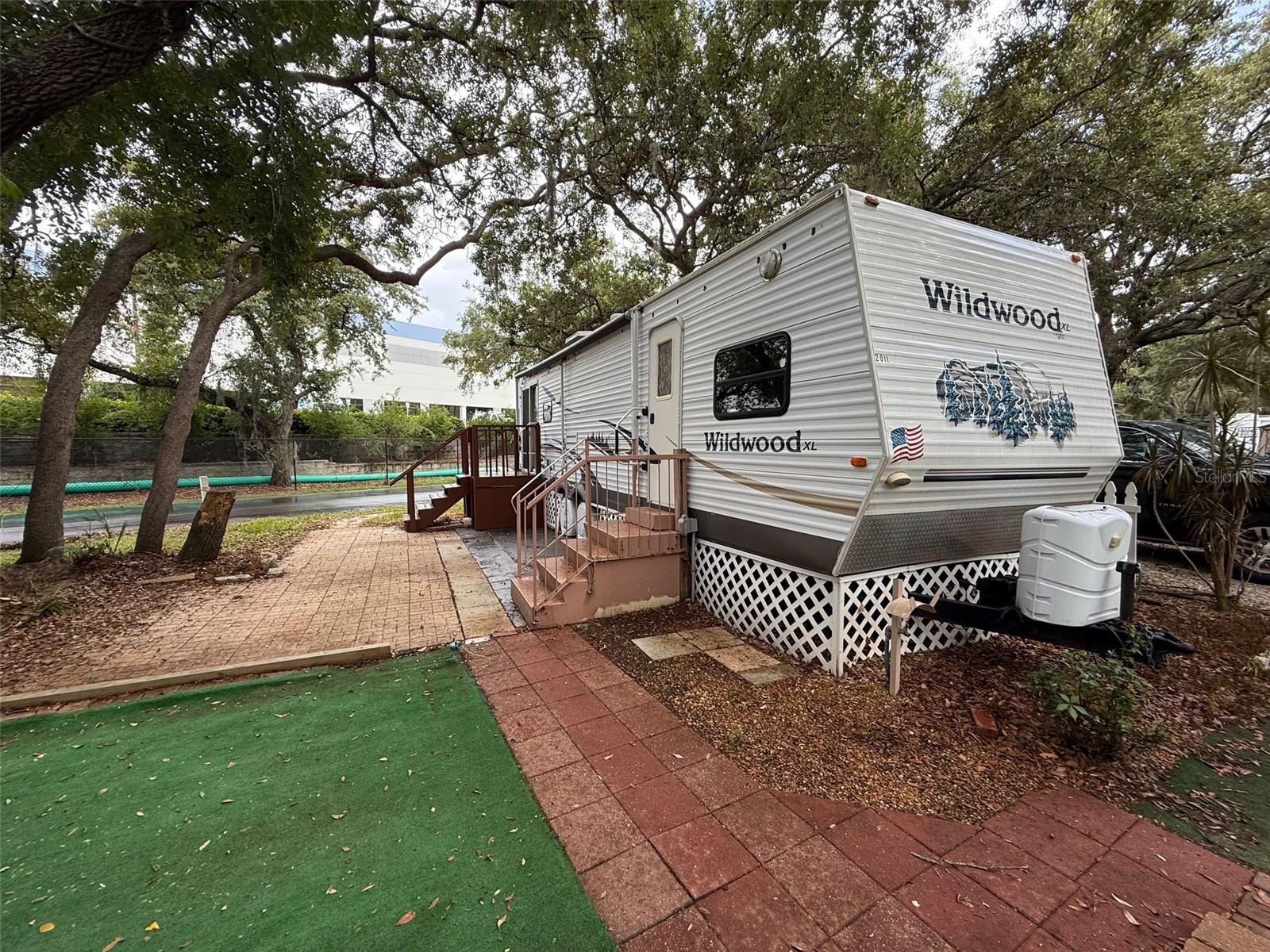 1 bedroom 1 bathroom Park model trailer in a gated RV park. Located near West Orange trail and close to bus route, shopping, hospital, 30 minutes from Disney. Rent includes water, sewer, garbage pick-up, gated community with virtual guard, swimming pool, basketball, shuffleboard, mini-golf and much more.