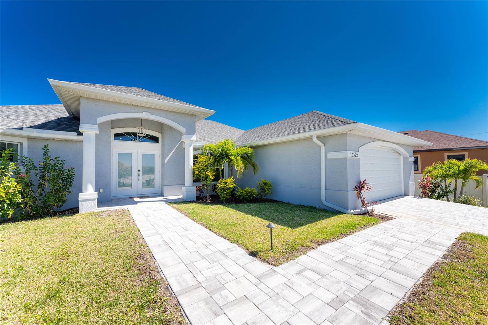 Welcome to your own slice of paradise in South Gulf Cove on Florida's beautiful Cape Haze Peninsula. This stunning turnkey-furnished Gulf Access waterfront home is ready for immediate enjoyment—simply bring your suitcase and start living the Southwest Florida lifestyle you've been dreaming about.

Built in 2022 and barely used, this like-new residence offers three bedrooms, two bathrooms, and an impressive blend of luxury, comfort, and smart-home technology. From the moment you enter, you'll appreciate the bright, open-concept design, enhanced by hurricane-impact windows, doors, sliding glass doors and custom window treatments that fill the home with natural light while providing peace of mind. 

The gourmet kitchen features high-end appliances and serves as the centerpiece for entertaining family and friends. Sliding glass doors open seamlessly to your private outdoor oasis, where Florida living truly comes to life. Spend sunny afternoons relaxing by the sparkling pool, unwind in the hot tub after a day on the water, or host unforgettable gatherings overlooking the canal.

For boating enthusiasts, the custom composite dock and boat lift with water and electric provide convenient sailboat access to Charlotte Harbor, Boca Grande Pass, and the Gulf of Mexico. Imagine stepping out your back door for sunset cruises, world-class fishing adventures, waterfront dining, and endless days exploring Southwest Florida's waterways.

This fully integrated Smart Hub Home allows you to control cameras, irrigation, pool, spa, lighting, and more directly from your phone through CommandIQ. Additional upgrades include underwater fish lights, a complete landscape lighting package on timers and sensors, concrete landscape curbing, Smart TVs, an epoxy-coated garage floor, and beautifully maintained tropical landscaping.

South Gulf Cove residents enjoy an active waterfront lifestyle with community parks, walking paths, a clubhouse, and a public boat ramp. You'll also be just minutes from Boca Grande, Englewood Beach, Manasota Key, championship golf courses, waterfront restaurants, and some of Florida's most spectacular Gulf Coast beaches.

Whether you're searching for a year-round residence, seasonal retreat, or investment opportunity, this move-in-ready, turnkey waterfront home offers everything you need to start enjoying the Florida lifestyle from day one.