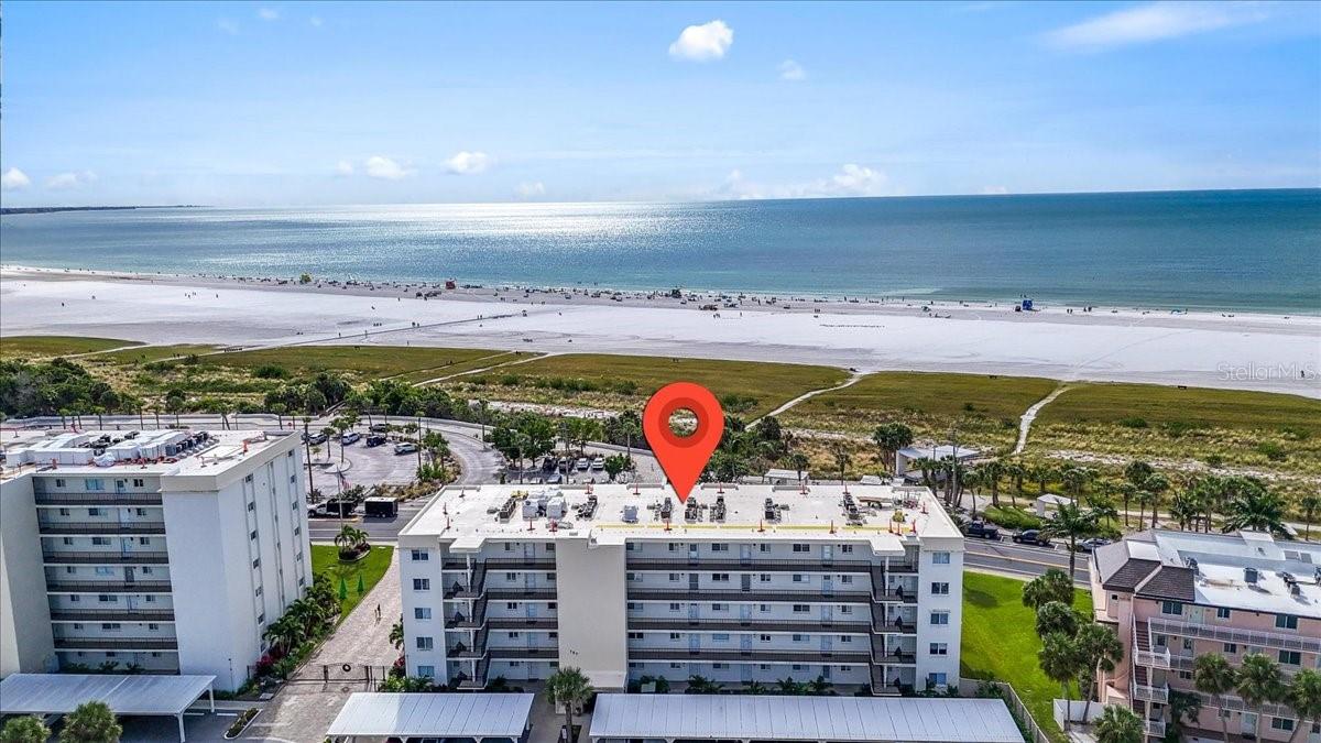 Front  row view of the world-renowned Siesta Key Beach. This unit is situated right across from the public beach and is withing 0.9 miles/3 minutes to the village. This turnkey fully furnished and equipped unit is move in ready. Right thru the front door you are greeted with an open floor plan overlooking the beach and the gulf water views. Smell the salt air as you lounge or dine on your large private screen in patio. The unit offers a beach vibe paint palette well-appointed furnishing and shows ownership pride. As you enter you are greeted with a large kitchen with stainless steel appliances an abundance of cabinets and granite counter tops and a large island. The kitchen is fully stocked and ready for all your cooking needs. Next to the kitchen is a large dining area with a table for 6. The living room also overlooks the beach and water views. It has a large sectional and side chair plenty of room for all your guests. This unit offers a master suite overlooking the gulf with an ensuite full bathroom. The guest room is also a great size and has a full attached bathroom. Both bedrooms have oversized walk-in closets plus a separate owner's closet. The unit also offers luxury vinyl flooring, tile and carpet. Impact patio doors for a piece of mind. The community is gated, and you have an assigned carport for parking. Crescent Royal has a managed onsite weekly rental program. The site offers a heated pool, fitness center, shuffleboard, and a grilling area.  Public beach is right across the street. Also, there is Trolley that gives you access to the village or take a short stroll to dining, entertainment, shopping and yes sand dollar picking on the sand bar. This unit is currently in the rental program and has an excellent rental history and future bookings. The gulf is calling don't miss this beautiful beach retreat.