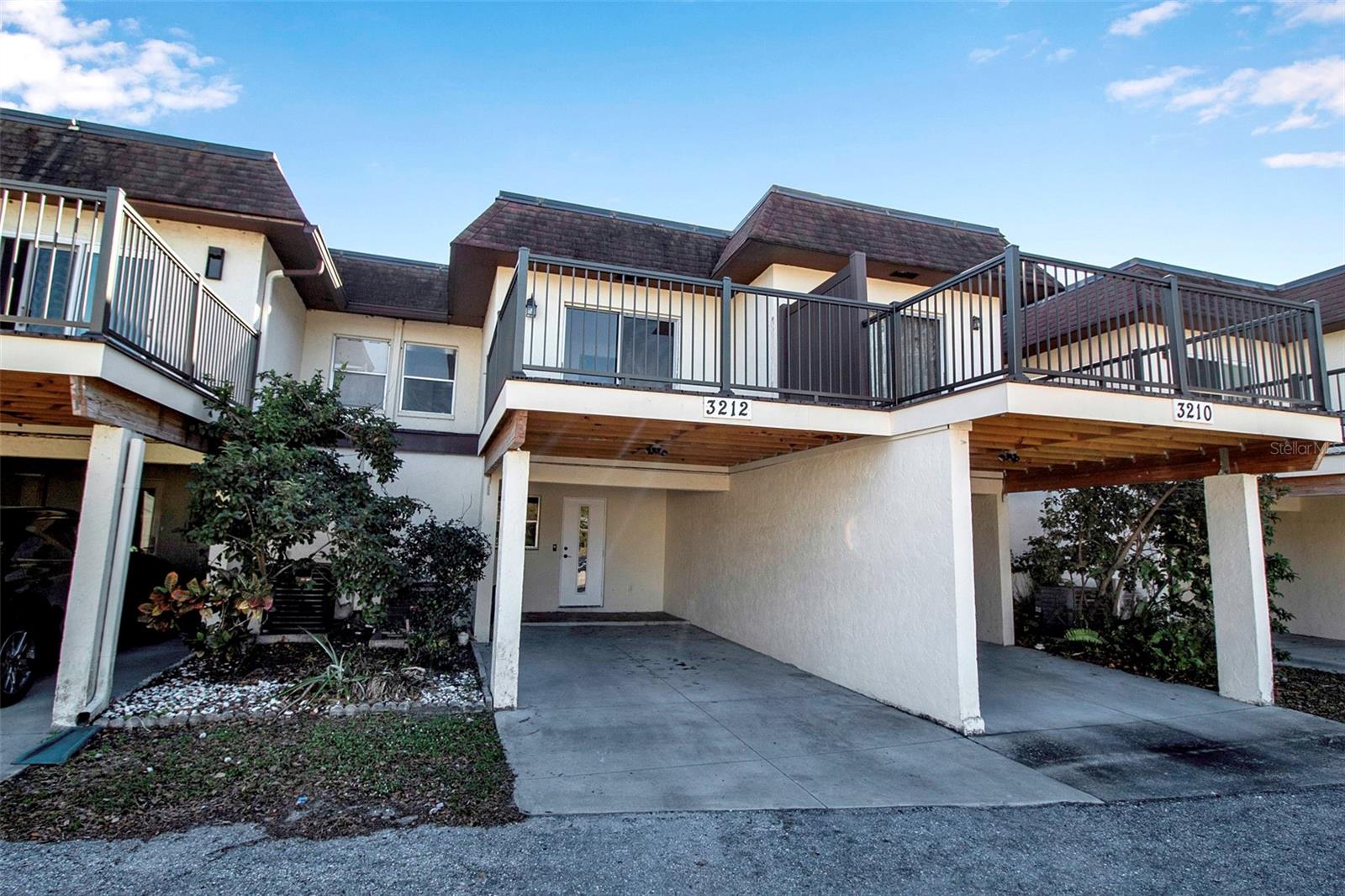 Discover your perfect updated retreat at 3212 Ramblewood Drive North, in vibrant Sarasota, Fl! This stylish 3- bedroom, 2.5 bathroom townhouse spans 1,343 square feet, offering a blend of comfort and modern living. Step into the freshly painted unit, a convenient half bath as you walk in, and an open-concept living room that flows to the back screened-in patio. The three bathrooms are situated upstairs providing privacy and comfort. The primary suite has access to an expansive new deck above the carport where you will be able to enjoy some relaxation and a breath of fresh air. Being able to keep your car in the carport away from the Florida Sun is a great benefit! This unit is a short walk to one of the pools. Nestled in a gated community, you will have access to three refreshing pools, a tennis court, a playground and a clubhouse. Being minutes away from Downtown Sarasota this is a must-see. You are a mere 20-minute drive from Siesta Key Beach and within 10 minutes of the Airport and UTC.