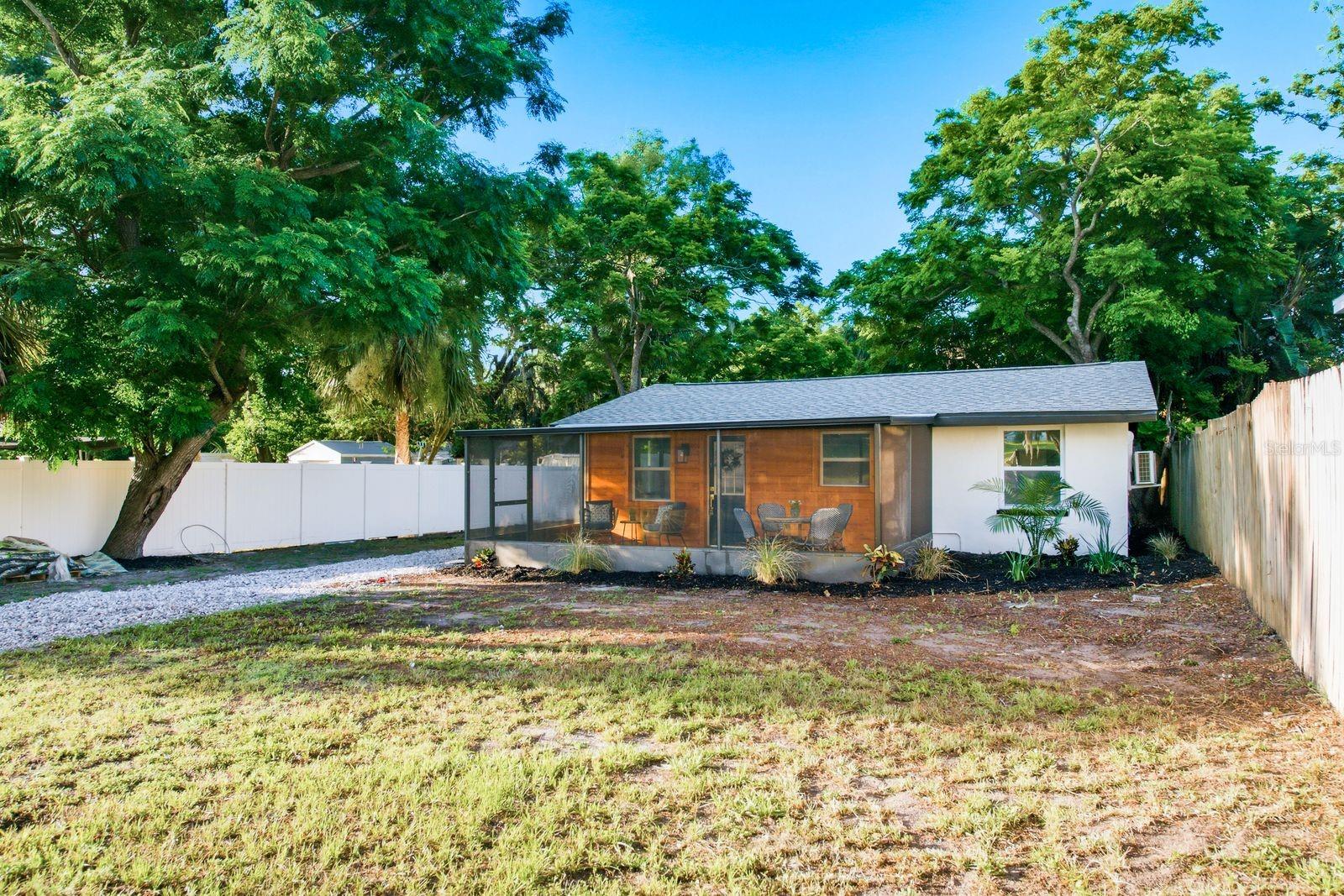 Move-in ready and full of charm! This updated home sits on an oversized lot directly across from a large open field, giving it a wonderfully private, park-like feel.

Inside, you'll love the bright, updated kitchen with solid wood shaker cabinets, gold hardware, quartz counters, and stainless appliances. The bathroom is a showstopper with a custom wood vanity, brass fixtures, and a striking navy tile shower. Luxury vinyl flooring flows throughout.

A new septic system and updated HVAC mean major updates are already done. Plus a new gravel driveway adds great curb appeal!

Unwind on the screened front porch under the shade of mature trees, or take advantage of the spacious lot for gardening, parking, or storage.
Perfect for homeowners and investors alike, this one checks all the boxes. Don't miss it!