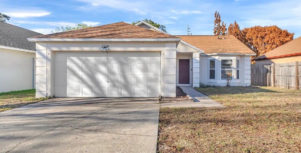 For Sale This charming 3-bedroom, 2-bathroom single-family home offers a bright, move-in-ready layout perfect for comfortable living, complete with the peace of mind of a 2020 roof and newer interior paint. The exterior features an attached garage, a classic stucco finish, and a welcoming front entrance. Inside, an expansive open-concept living area boasts high vaulted ceilings, modern ceiling fans, low-maintenance tile flooring, and large sliding glass doors that lead out to a spacious, fully fenced backyard. The updated kitchen serves as the heart of the home, beautifully equipped with contemporary gray cabinetry, stainless steel appliances, and rich, polished wood-look countertops that overlook the living space via a convenient breakfast bar. Each bedroom features plush, neutral carpeting, including a primary bedroom highlighted by an elegant architectural bay window. Completing the interior are two pristine bathrooms that mirror the kitchen's modern gray vanities and polished wood-look countertops, each offering a full tub and shower combination. Situated in the highly coveted Cross Creek community, this home is just minutes from Narcoossee Road, US-192, and a variety of local dining, shopping, and schools. Perfect for recreation and leisure, you are a short drive from Lakefront Park, Peghorn Nature Park, and the unique charm of Historic Downtown St. Cloud. This prime location ensures effortless commuting and puts every daily convenience right at your fingertips.