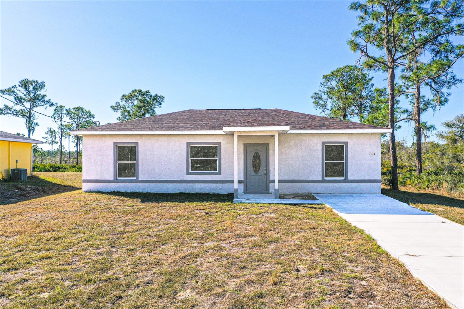One or more photo(s) has been virtually staged. SELLER AGREES TO CONTRIBUTE UP TO $8,000 TOWARD BUYER’S CLOSING COSTS. Welcome to Highlands Park Estates. This beautiful, custom-built 2025 home features 3 bedrooms and 2 full bathrooms, offering comfortable and easy Florida living. The bright, open-concept floor plan seamlessly connects the living, dining, and kitchen areas, while durable ceramic tile flooring flows throughout the home. The kitchen includes all brand-new stainless steel appliances and plenty of workspace. A separate laundry room adds convenience, and the primary suite features an ensuite bathroom and a spacious walk-in closet. Step outside to the open back porch—perfect for morning coffee or evening relaxation—overlooking a generously sized approximately ¼-acre lot. Located in a USDA-eligible area with no HOA, this home also comes with a one-year home warranty for added peace of mind. Nestled in a quiet Lake Placid neighborhood, it’s just minutes from shopping, dining, and local lakes. Near major highways; Hwy 27 and I4. Ideal as a full-time residence, seasonal retreat, or investment opportunity.