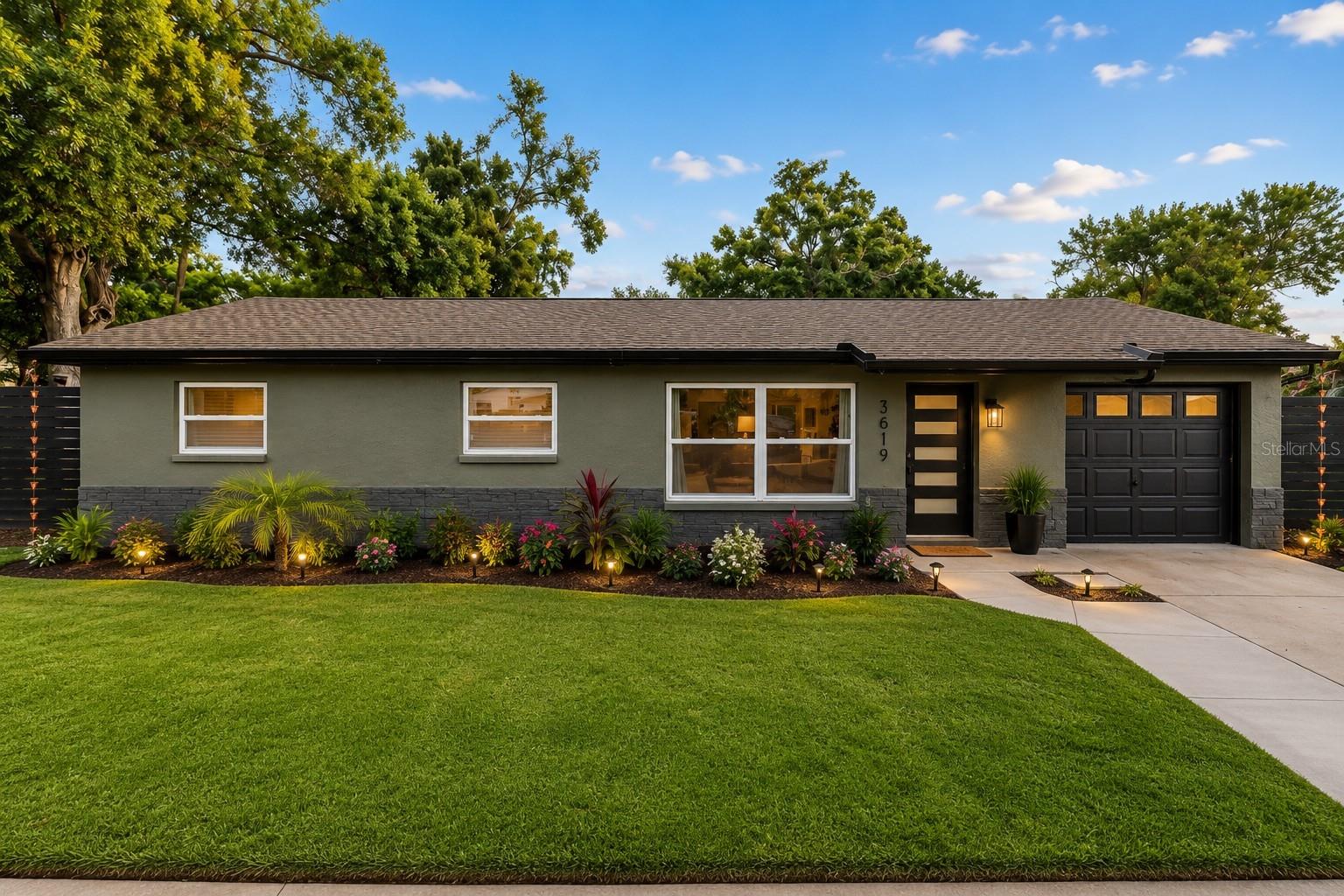 Fully reimagined and truly move-in ready, this beautifully remodeled St. Petersburg home blends designer style with everyday livability on an oversized lot with real upside. Behind a modern frosted-glass entry and fresh stucco exterior, 1,814 square feet of open-concept living unfolds with wide-plank flooring, statement ceilings, and layered lighting that feels custom at every turn.
The kitchen is the showpiece, anchored by a waterfall quartz island, custom shaker cabinetry with warm copper hardware, a hammered copper farmhouse sink, stainless appliances, and a full marble-look backsplash, all open to a spacious family room and sliding doors to the backyard. Two separate living areas give you room to gather and room to retreat, while a built-in wet bar makes entertaining effortless.
Four bedrooms and two spa-inspired baths carry the same level of finish, including a serene primary suite with a walk-in closet, dual-vanity bath, wood-slat walk-in shower, and backlit lighting. A generous fourth bedroom just off the laundry room offers a flexible guest or in-law setup.
Even better, the home comes with fully owned, paid-off solar, so the new owner steps into electric bills that average just $35 to $40 a month. That is Florida living with the summer power bill worry taken off the table.
Outside, a large screened lanai overlooks a deep, fully fenced yard framed by mature oaks, with room to add a pool, a workshop, or more. The rare bonus: the oversized lot offers the potential to separate into two parcels, opening the door to future income or a build opportunity you almost never find this close to downtown. Minutes to I-275, downtown St. Pete, and the beaches, this one is turnkey living with built-in upside.