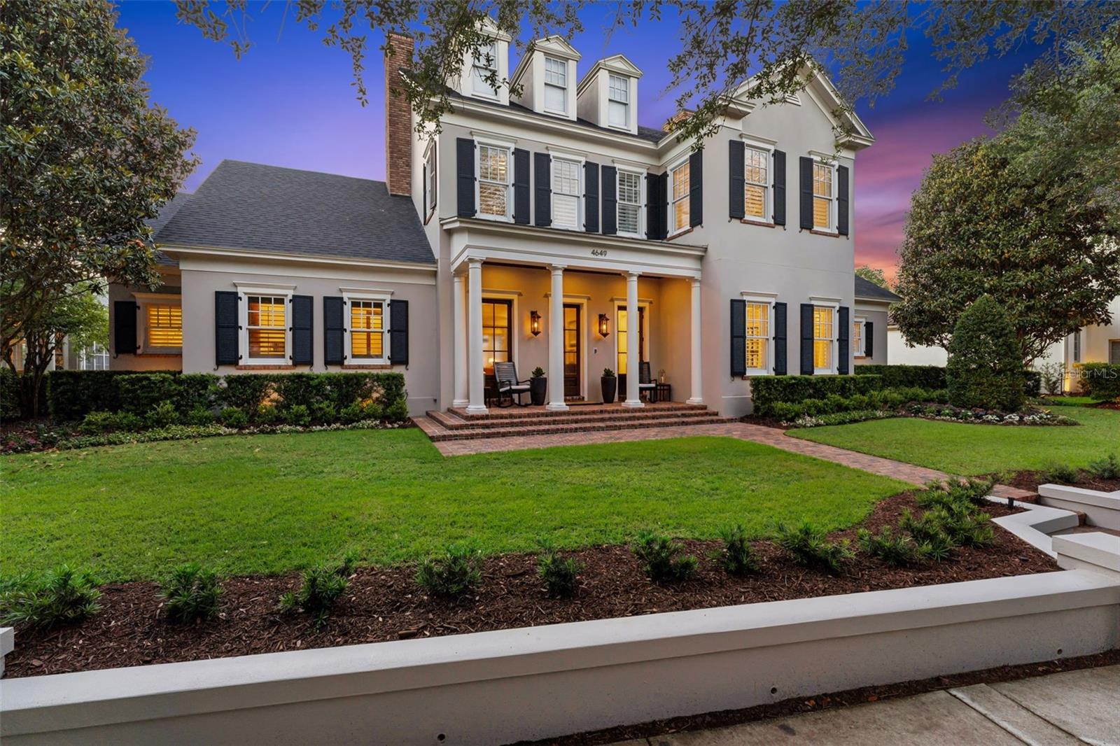 Price Improvement on this exquisite Baldwin Park Estate! Framed by mature oaks and set along Baldwin Park’s iconic main boulevard, this stately custom home and former Parade of Homes winner offers a truly exceptional setting overlooking a serene park and picturesque pond with a cascading waterfall.



A classic columned façade and welcoming brick-paver front porch lead to a gracious entry, opening into an impressive living room anchored by a Beautiful gas fireplace. Just off the entry, a handsome first-floor study features extensive millwork, custom built-ins, and an ensuite bath, offering flexibility as a private guest suite or fifth bedroom.



Designed for both everyday living and entertaining, the home flows seamlessly from space to space. The beautifully renovated kitchen is a true centerpiece, featuring a rare blue quartzite island, refined cabinetry, designer lighting, and a full suite of premium Dacor appliances. The kitchen opens to a spacious family room and casual dinette, while a separate formal dining room provides an ideal setting for more formal gatherings. A dedicated theater room with plush leather recliners, a newer Sony theater projector, and updated surround sound adds to the home’s versatility.



The first-floor primary suite offers a private retreat with dual walk-in closets and an enviable ensuite bath finished in marble and complemented by all new lighting and fixtures. Upstairs, three additional bedrooms and fully renovated bathrooms showcase marble finishes, custom glass enclosures, and elevated fixtures throughout. A spacious loft-style living area adds another layer of flexibility, complete with custom cabinetry and a wet bar—perfect as a secondary lounge, game room, media space, or private retreat.



Outdoor living is equally impressive, with a covered rear lanai featuring a fireplace and wood-paneled ceiling, overlooking a recently resurfaced saline pool and spa, surrounded by lush, professionally designed landscaping.



Extensive upgrades provide peace of mind, including a newer roof, multiple HVAC systems with transferable warranties, updated pool equipment, smart home integration, enhanced security, and more. Please see the attached upgrades sheet for a full list of recent renovations and improvements.



All of this, ideally located within Baldwin Park—one of Orlando’s most sought-after communities—offering top-rated schools, parks, three community pools, and a vibrant downtown with dining, shopping, and everyday conveniences just moments away.



This is a rare chance to own a signature custom residence in one of Baldwin Park’s most coveted locations—private showings available by appointment!