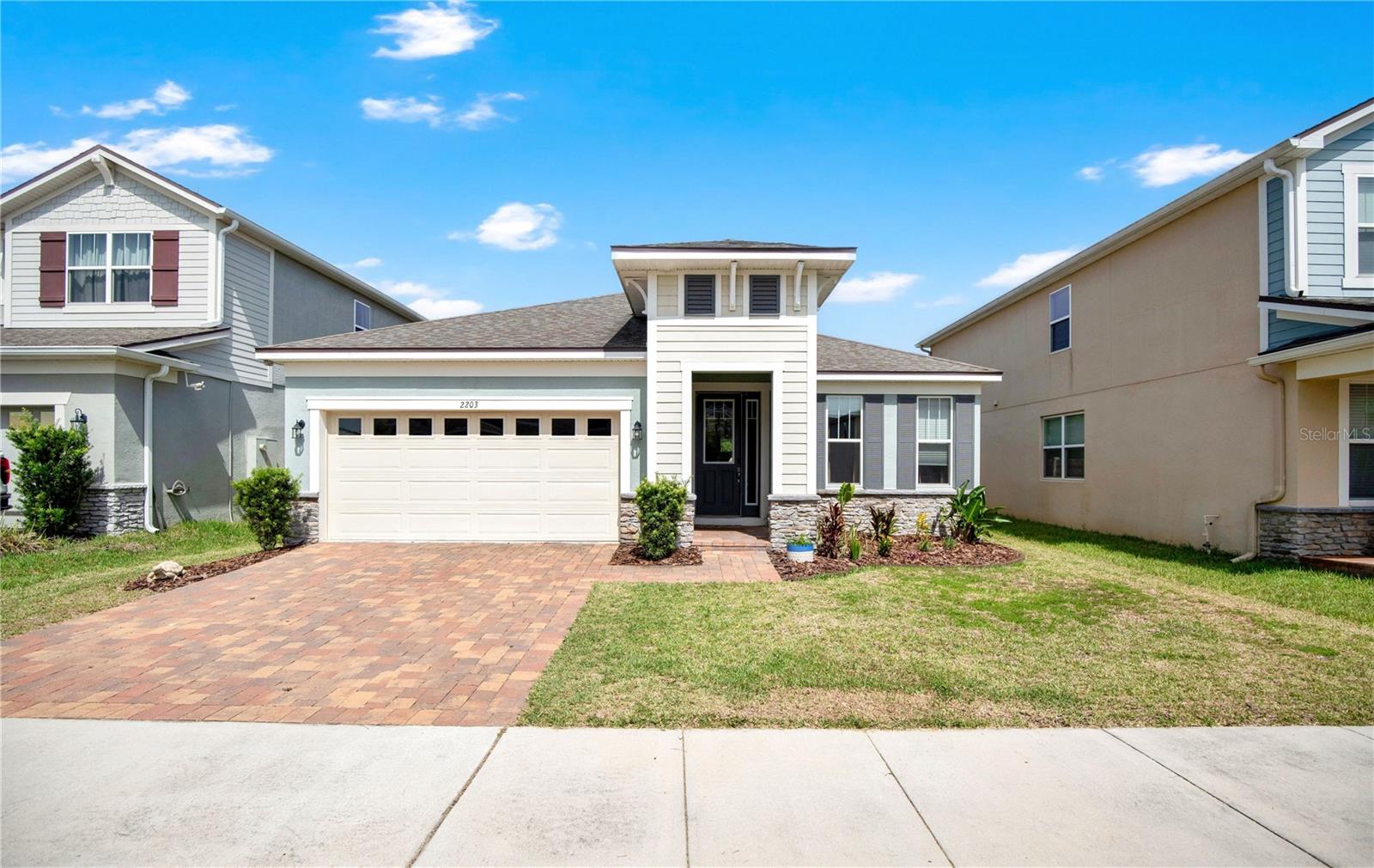 Welcome to this beautifully maintained 4-bedroom, 2-bath home in the highly desirable gated community of Waterbrooke in Clermont. Built in 2020, this spacious home offers an open-concept layout with abundant natural light, ceramic tile flooring throughout the main living areas, and a split-bedroom floor plan designed for comfort and privacy. The gourmet kitchen features granite countertops, stainless steel appliances, a large center island, and ample cabinet space, making it perfect for entertaining. The private primary suite offers a spacious walk-in closet and an en-suite bath with dual vanities and a walk-in shower. Enjoy relaxing on the covered lanai overlooking the backyard. Waterbrooke residents enjoy outstanding community amenities including a resort-style pool, fitness center, playground, and gated entrance. Conveniently located near Highway 50, Highway 27, the Florida Turnpike, shopping, dining, and top-rated attractions. This move-in-ready home is one you won't want to miss!