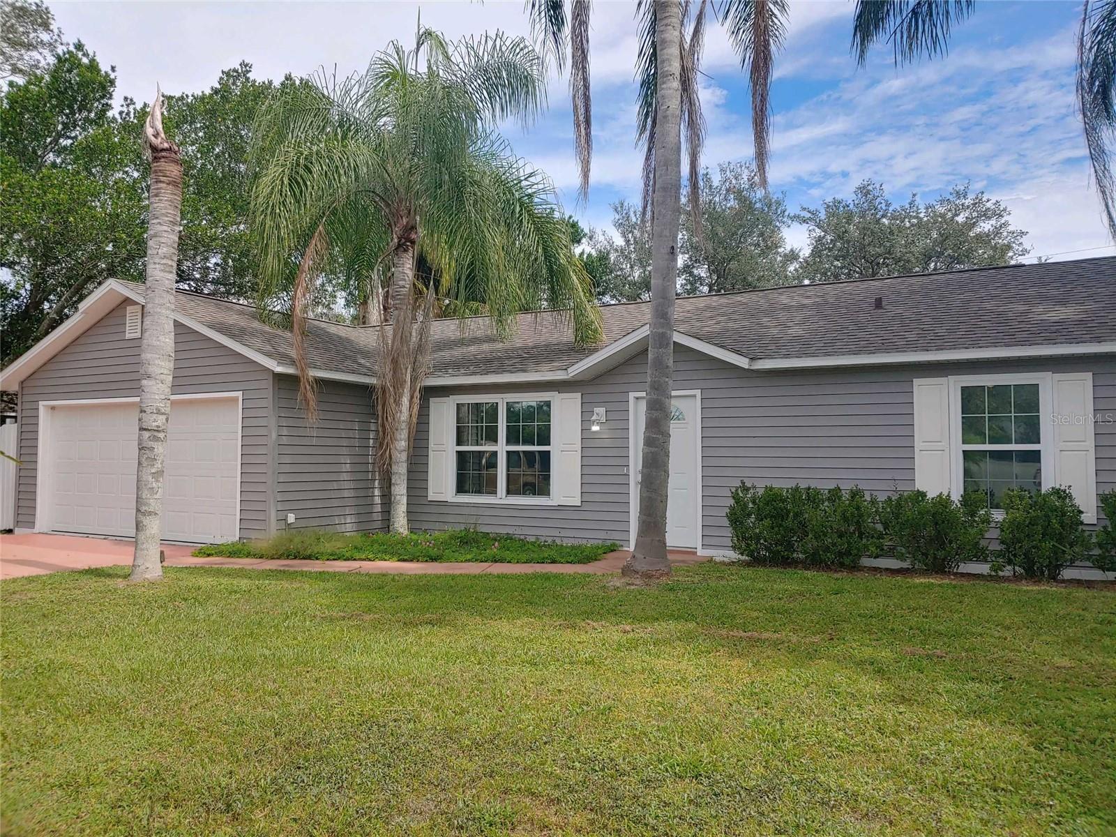 A beautiful 3 bedroom home with a screened in pool!  New flooring in the bedrooms, fresh paint inside and out, roof 2021, new vinyl siding 2023, new water heater 2023, new panel box 2023, new windows 2023 all permitted! The range and microwave are brand new and the refrigerator is 3 years old.  Close to schools, shopping and parks. Don't let this one pass you by!