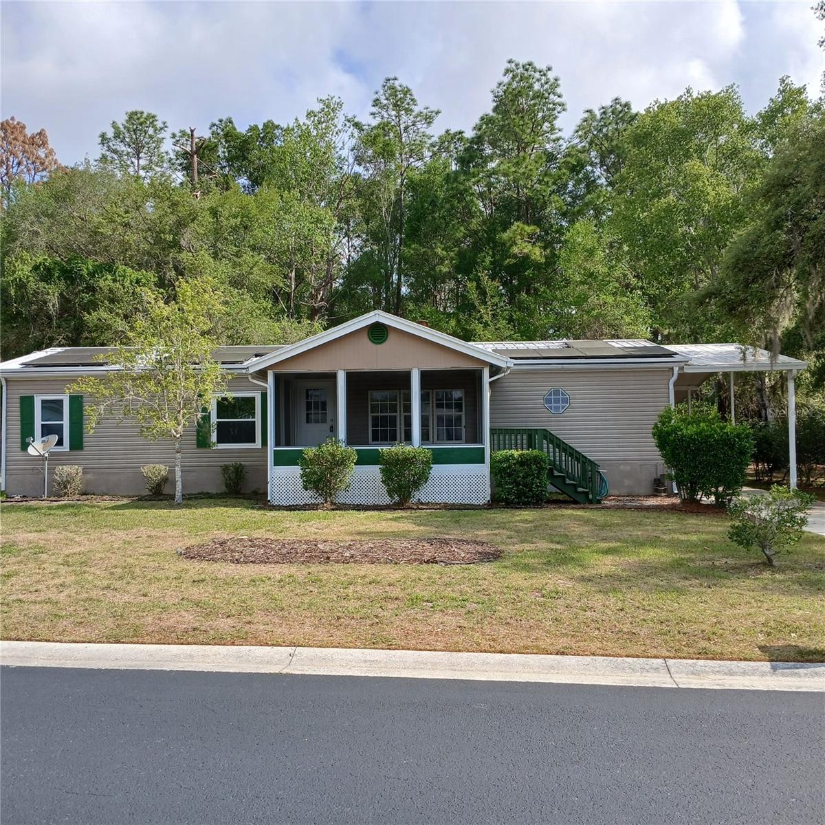 Beautifully updated and truly move-in ready, this meticulously maintained home offers the perfect blend of comfort, style, and efficiency in a desirable 55+ community where you own the land. Installed in 2024 and paid off at closing, the solar panel system delivers outstanding energy efficiency and long-term savings.
The updated kitchen features brand-new stainless steel appliances including a microwave, oven, and refrigerator, along with a sleek black glass-top electric range, new stainless steel sink, and an upgraded pantry with custom shelving for exceptional storage and organization.
The guest bathroom has been tastefully refreshed with a new vanity, mirror, toilet, brushed nickel fixtures, and wall cabinet. The fully renovated primary bathroom is a standout, showcasing a gorgeous walk-in shower with barn-style glass sliding doors, double vanity with dual mirrors, new toilet, and contemporary finishes throughout.
Additional upgrades include a water softener system connection and an included hot tub, creating the perfect private retreat. Enjoy Florida living year-round from the screened front and rear porches, while the covered carport adds convenience and protection. Inside, vaulted ceilings create an open, airy atmosphere, and the cozy fireplace adds warmth and charm to the main living area.
Curb appeal shines with a freshly painted front porch and steps, complemented by a new stone walkway welcoming you home. Washer and dryer are also included for added convenience.
Located in the highly sought-after Crystal Pointe community just south of Lake Rousseau, residents enjoy an amenity-rich HOA featuring a pool, clubhouse, cable, lawn care, recreational facilities, trash service, water, and Wi-Fi—making maintenance-free living easy and affordable.
Conveniently situated near shopping, dining, medical facilities, and the natural beauty of the Dunnellon area, this home is also located outside of high-risk flood zones (buyer to verify). Perfect for snowbirds, downsizers, or anyone seeking updated and affordable Florida living in an active 55+ community.