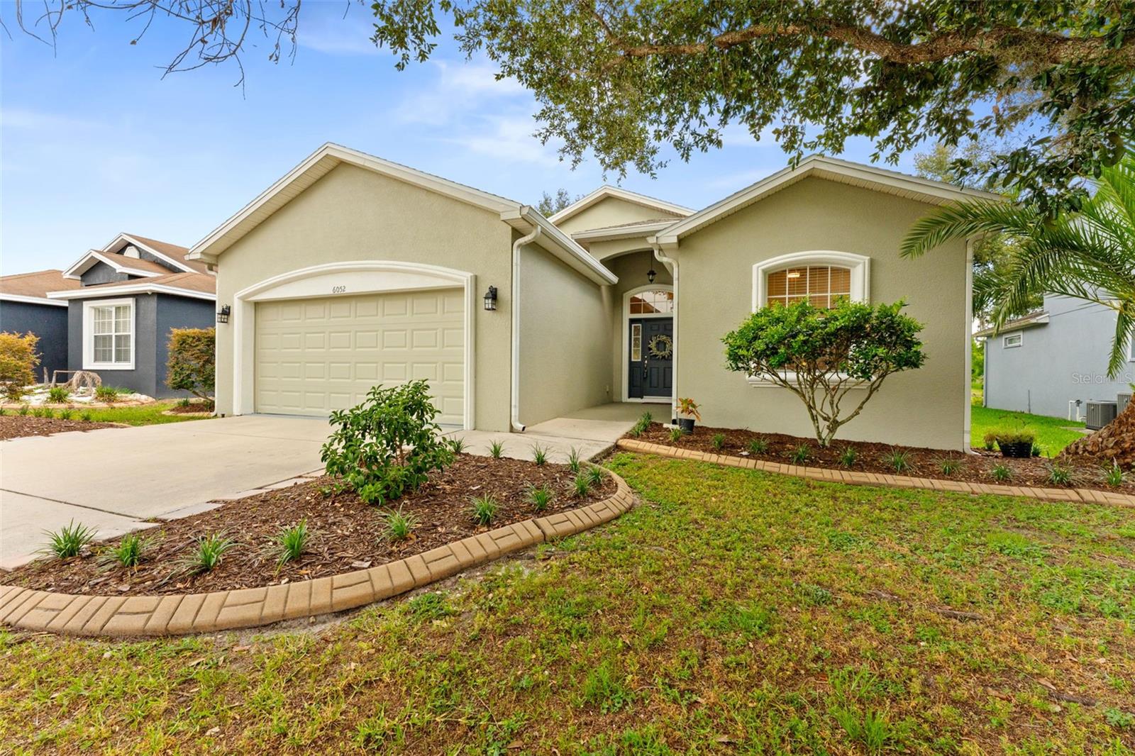 Virtually Staged. Move-In Ready Former Model Home with $5K Seller Credit with an accepted offer!
Enjoy the ultimate peace of mind with NO CDD and low HOA fees in this NEWLY RENOVATED 1,501 sq ft home. This immaculate
3-bedroom, 2-bathroom property features a BRAND-NEW 2026 ROOF with a fully transferable warranty, a 2022 HVAC, and fresh interior and exterior paint.
Step into a proper foyer that opens into an expansive 30-foot-long dining-and-family room combo, perfectly laid out for entertaining. Top-of-the-line waterproof wood-look laminate flooring flows seamlessly throughout the entire home. The updated kitchen is a chef’s delight, boasting extended cabinetry, premium stone countertops, a breakfast bar, stainless steel appliances, and a cozy breakfast nook.
The primary suite serves as a private retreat, featuring all new high-end ceramic tile flooring, quartz countertops, dual sinks, a relaxing garden tub, and a separate walk-in shower. Practical luxury abounds, with an indoor laundry room featuring custom cabinetry and a fandelier! The full-size garage includes a rare, dedicated 10’x 10’ storage room. Outside, relax on your oversized 24' x 13' screened lanai, overlooking a peaceful pond view and a fully fenced backyard.
Schedule a showing soon before this home is gone!