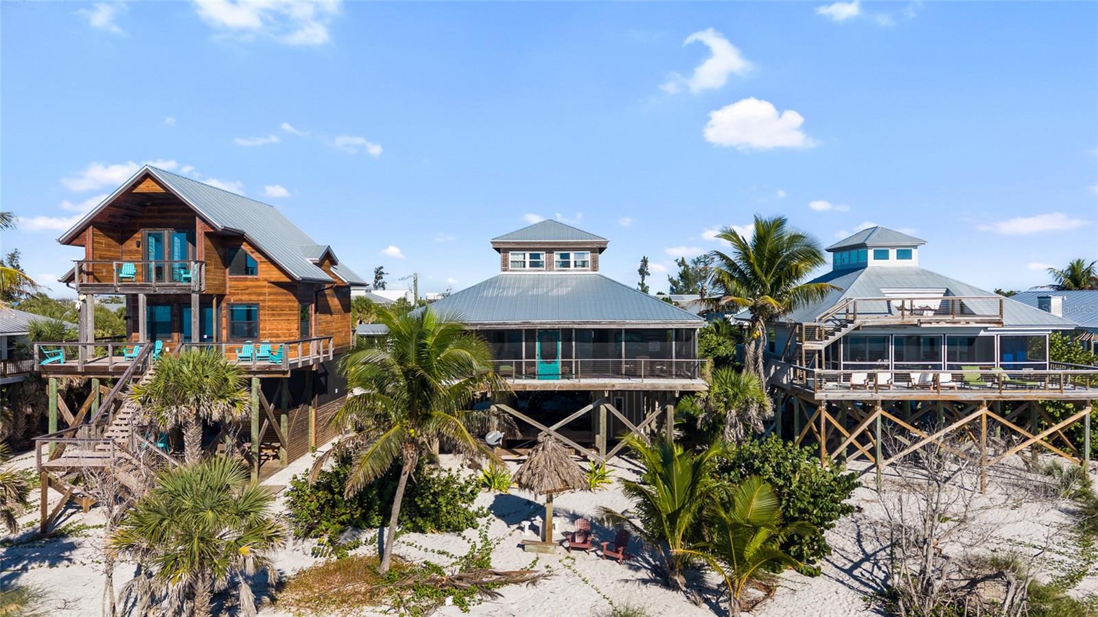 Price reduced on this charming beachfront home radiates Old Florida charm and is located on Little Gasparilla Island. LGI is a bridgeless barrier island situated off the coast of the Cape Haze Peninsula accessible only by private boat or water taxi, and it offers a peaceful escape in just a short 10-minute ride across the bay. If you’re seeking a quiet getaway, Little Gasparilla Island is the perfect destination. As soon as you arrive, you’ll feel the stress of the mainland melt away. The home features warm wood walls and floors throughout, creating a cozy and comfortable atmosphere. The spacious, screened-in front porch overlooks the Gulf, providing an ideal spot to unwind. Here, you can watch shore birds meander along the surf, spot dolphins and manatees swimming by, or simply enjoy a restful nap in the hammock, and at the end of the day watch the gorgeous sunsets. The kitchen is equipped with granite countertops, ample cabinetry for storage, and a large pantry. You’ll enjoy beautiful views of the water from the kitchen, dining room, living room, and the loft bedroom upstairs. The screened-in back porch is perfect for savoring your morning coffee while watching the sunrise glow through the trees. Both porches offer unique vantage points to enjoy the natural beauty surrounding the home. Little Gasparilla Island doesn’t have any grocery stores, restaurants, or shops, but has 3 ½ miles of uncrowded beach. Spend your days wandering the shoreline collecting seashells and shark’s teeth, swimming, or relaxing with a good book in the sun. The surrounding waters are excellent for fishing, with opportunities to catch redfish, snook, snapper, trout, and more. Come experience this lovely home and discover what it’s like to live on island time, surrounded by natural beauty and tranquility.