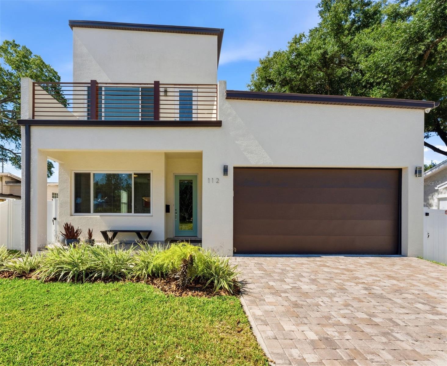 This Seminole Heights home delivers exactly what Tampa buyers are searching for: new construction peace of mind in one of the city’s most coveted neighborhoods. Built in 2022, this home gives you all the character and culture of Seminole Heights without the concerns of a historic home, since the roof, HVAC, plumbing, and electrical are all virtually new.
The layout is as smart as it is livable. A main-floor bedroom with its own full bath flexes perfectly as a home office, in-law suite, or private retreat for visitors. The open-concept kitchen and living area was made for real life, with solid-wood cabinetry, granite countertops, stainless steel appliances, and custom lighting including under-counter kitchen lights.
Upstairs, the oversized owner’s suite earns its title: two generous walk-in closets, a double vanity, and a large walk-in shower with dual shower heads that makes every morning feel like a fresh start. A spacious second-floor balcony off the second bedroom offers a surprising bonus outdoor living space.
Outside, a fully fenced backyard with a screened-in porch, paver patio for entertaining, professional landscaping, and irrigation system creates a private outdoor retreat that is completely turnkey. The attached 2-car garage also features an epoxy-coated floor and built-in ceiling storage system.
LOCATION, LOCATION, LOCATION! Just minutes from Armature Works and the Tampa Riverwalk, this address puts the very best of Tampa right at your doorstep. Walkable to award-winning restaurants, local breweries, and beloved coffee shops, this is Seminole Heights living at its finest.
Welcome home.