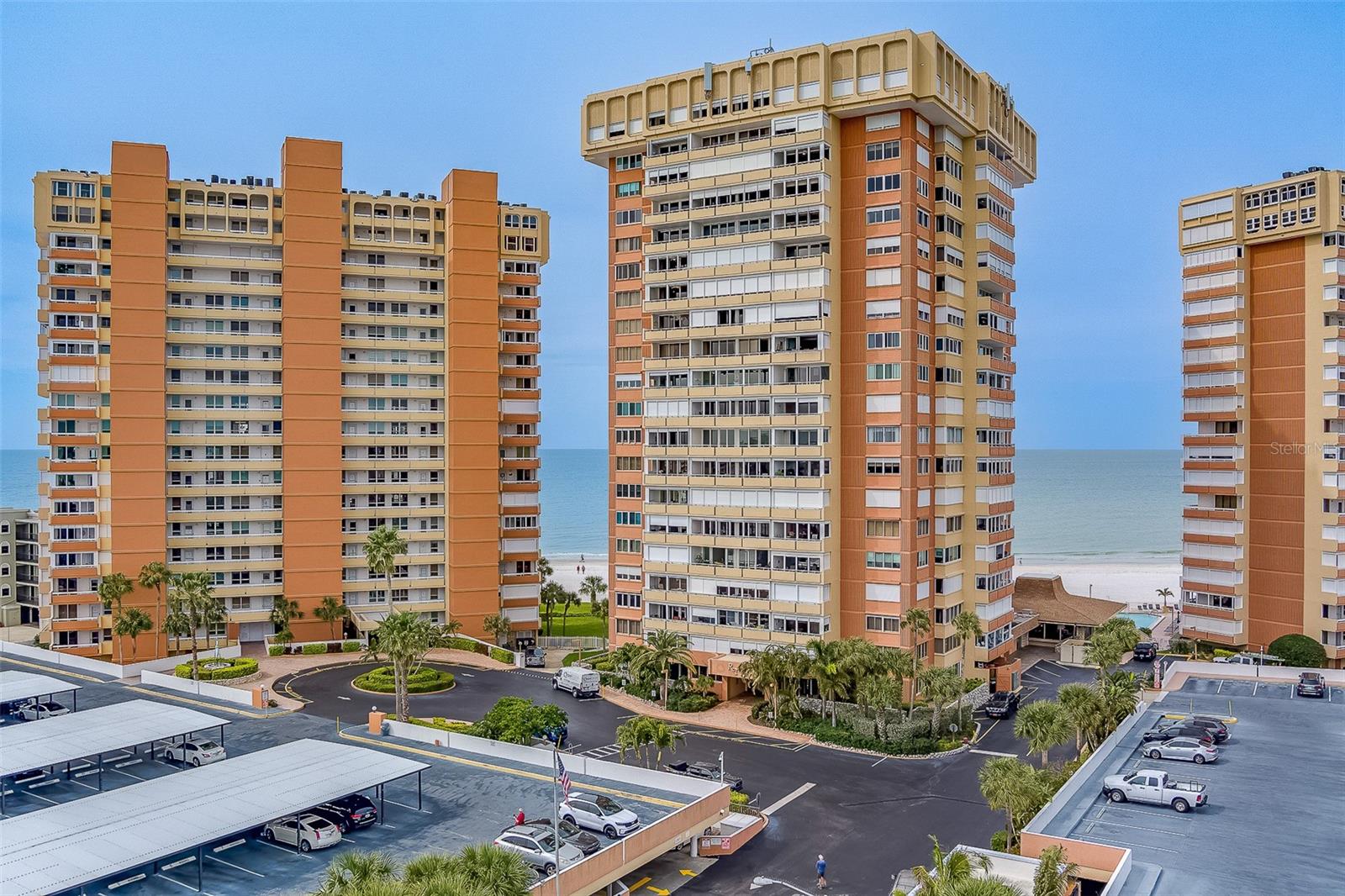 Welcome to Gulf front living with endless potential! This spacious condo offers stunning panoramic Intracoastal Waterway views that can be enjoyed from your large private balcony equipped with hurricane shutters—perfect for soaking in sunrises, watching boats drift by, and the sparkling city lights at night. Inside, you’ll find a generously sized kitchen with ample space to design your dream layout, along with an open living and dining room combination that creates a bright, airy feel. The master bedroom features a walk-in closet with ensuite, and the half bathroom ensures total privacy. This is an ideal opportunity to customize the space to your exact taste and add value! Convenience is key with laundry facilities located on each floor. The community is all-ages and offers a variety of amenities, including a waterfront pool, outdoor grill area, social room, community kitchen, exercise room, and a library—perfect for relaxing or gathering with neighbors. The building is currently undergoing exterior renovations, and access to some amenities may be limited during this time. However, these improvements are expected to enhance the overall appeal and long-term value of the property. Please note, this is a no-pet community. Whether you’re looking for a full-time residence, seasonal retreat, or investment opportunity, this condo presents a rare chance to create your own waterfront escape in a prime location.