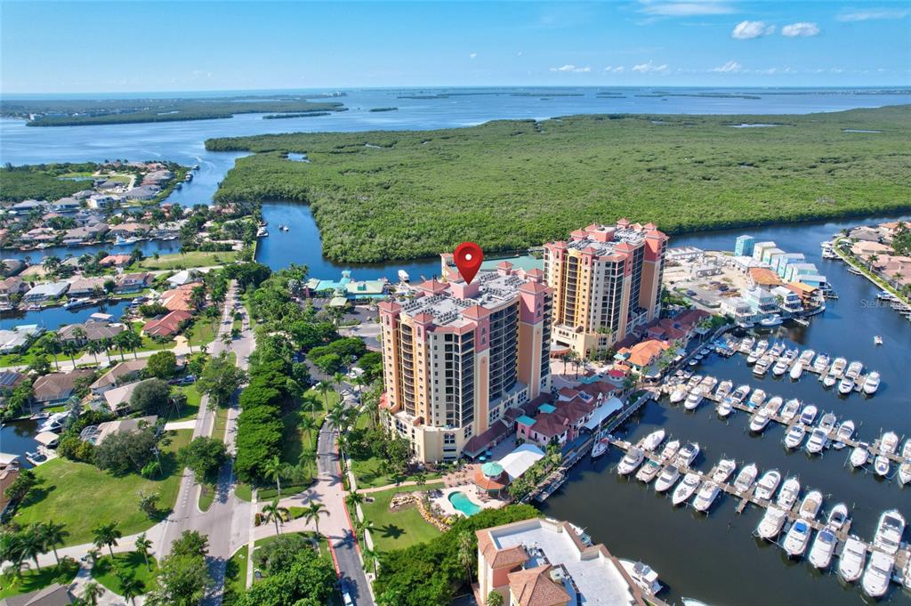 **Recent Price Improvement ~ Being Sold Fully Furnished**

Welcome home to resort style living in the highly sought after Water Front Yachting Community of Cape Harbour!  Picture waking up with a cup of coffee and relaxing on your private 12th floor patio, overlooking the marina while watching the yachts float out to the Gulf of Mexico; or better yet, how about sipping on a late afternoon cocktail with front row seats to the most amazing sunsets imaginable!  

As soon as you enter your new home you'll be impressed with the upgrades and attention to detail found throughout; not to mention the extra space, as this corner / end unit is the largest floor plan available!  The open concept is wonderful for entertaining, while the split floor plan is great for privacy and a little peace and quiet.  Inside you'll find 3 bedrooms, 2 baths, a separate laundry, bonus office / den, living, dining, and with a massive kitchen at the center of it all.  Notable upgrades include a complete new AC system, new water tank, impact windows and doors, granite counters, walk in closet, add-on kitchen closet cabinet / pantry, 18 inch tile on the diagonal, custom window treatments, floor to ceiling tiled and glass shower.

If the inside of the home has you excited, wait until you hear about the community!  Cape Harbour is amazing and offers their residents a lifestyle hard to find anywhere on the coast.  As part of your home ownership you'll have unlimited access to the community clubhouse, multiple pools, a fitness center, tennis courts, basketball court, pickleball court, and a full service marina with wet and dry slips!  The Harbour is also well known for their multiple waterfront restaurants, fishing charters, boat rentals, shops, live music, and numerous festivals throughout the year!  Residents and boaters alike travel from miles away, to enjoy what the residents of Cape Harbour get to live everyday...now's your opportunity to be a part of the excitement!