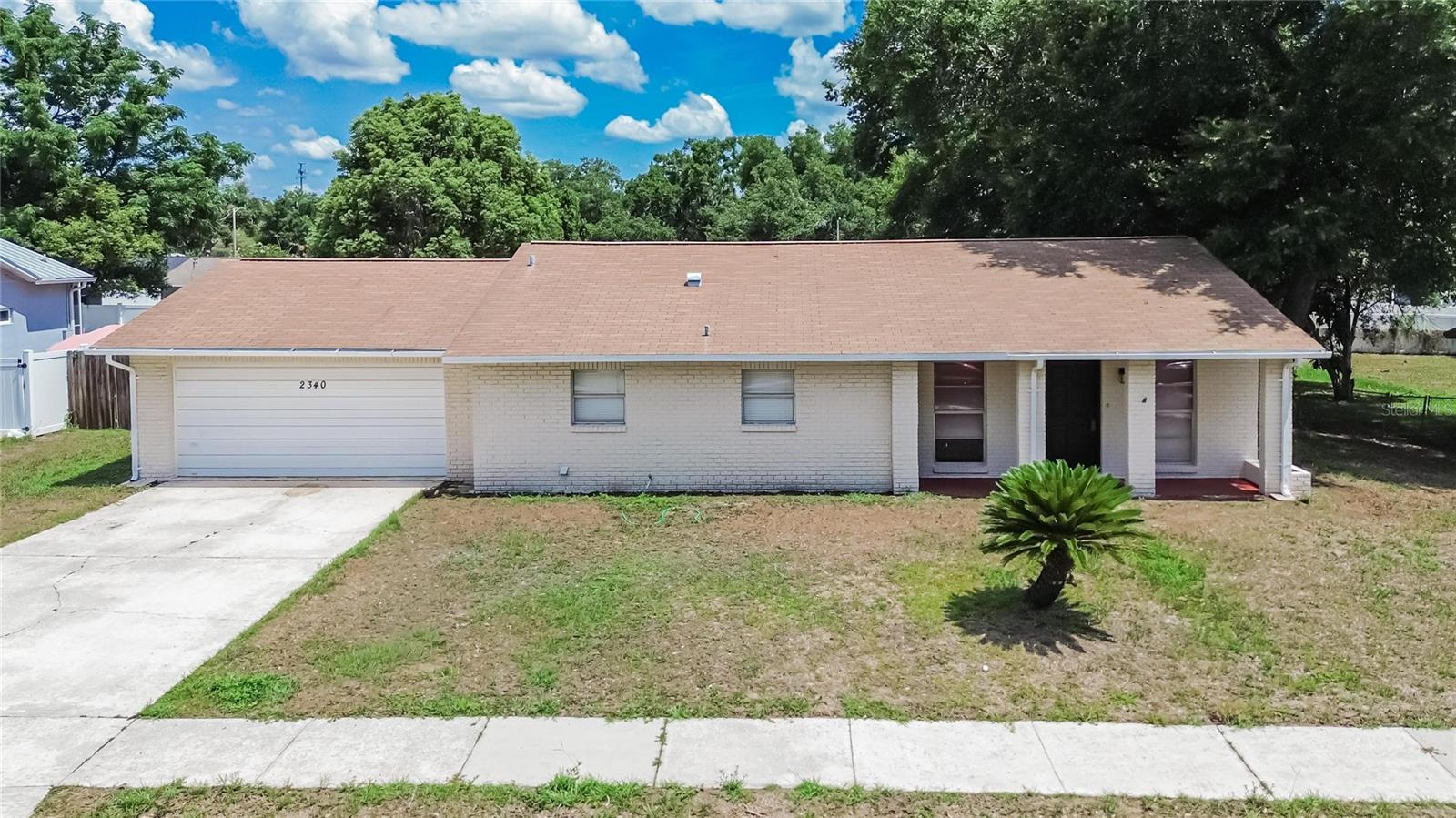 This move-in-ready gem is nestled in the beautiful community of Seffner, FL, featuring 3 bedrooms, 2 bathrooms, and sitting on a generous lot with plenty of room to enjoy. This stunning 1345 sq ft residence comes with NO HOA, giving you the freedom and flexibility you deserve.  The kitchen is truly the heart of the home, offering beautiful white cabinets, quartz countertops, subway tile backsplash, and ample counter space—perfect for preparing and sharing delicious meals. The kitchen opens directly into the spacious living room, making it ideal for both relaxation and entertaining. Enjoy Florida’s fantastic weather in your spacious fenced in backyard and screened in porch offering plenty of room for gatherings, summer cookouts, or simply unwinding outdoors. This home comes with the peace of mind knowing that the AC, water heater and septic have all been replaced recently. The extra-large 2 car garage gives you space for all your Florida toys. This beautiful home is ideally located with easy access to I-4 and I-75, providing quick routes to Tampa. You're also just a short drive from the Seminole Hard Rock Hotel & Casino and the Florida State Fairgrounds, placing entertainment and convenience right at your fingertips.