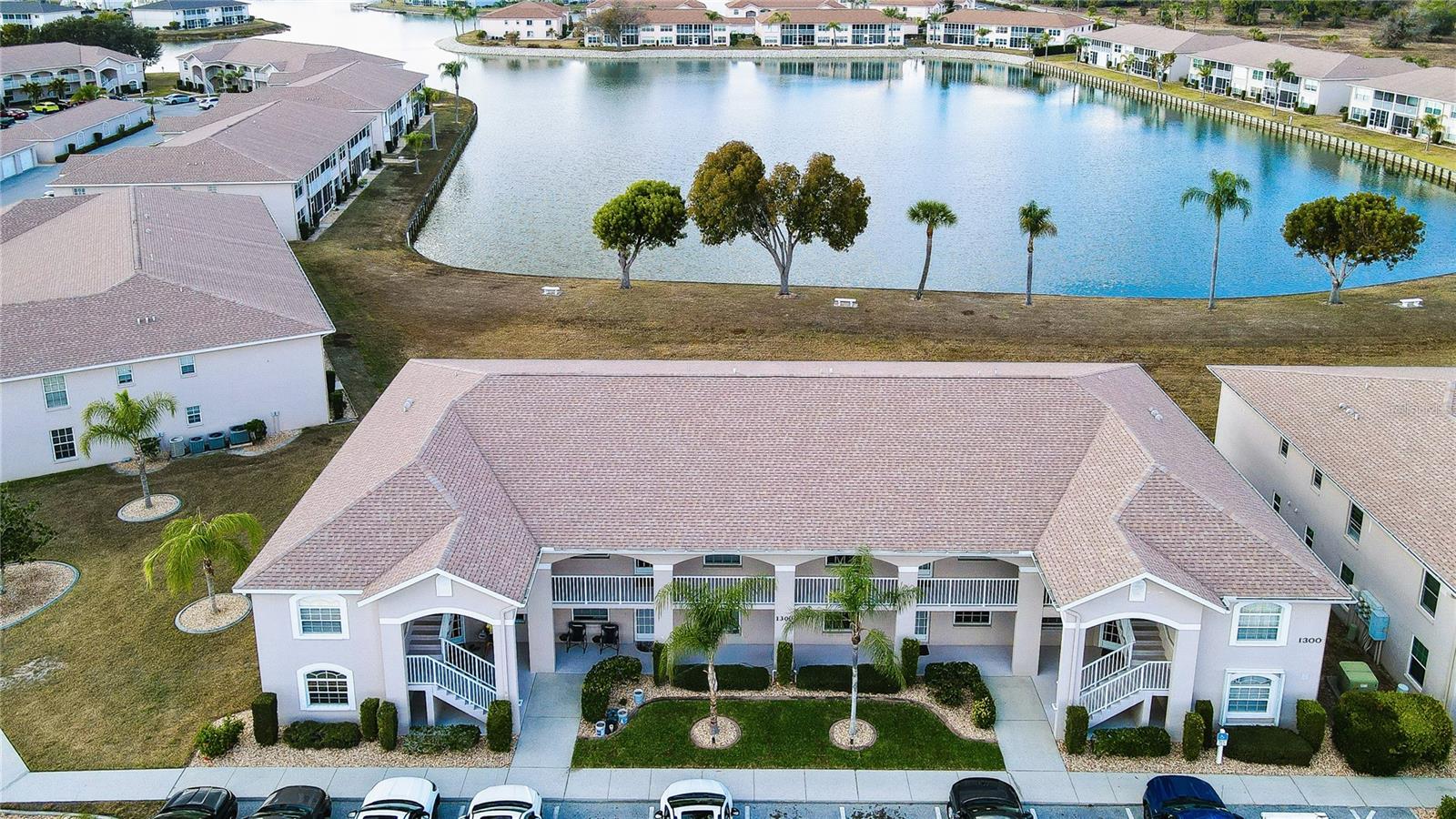 Enjoy peaceful lake views from this 2002 second-floor condominium located in the desirable Crystal Bay community in Lake Suzy. This well-maintained unfurnished, 2-bedroom, 2-bath residence offers high ceilings, a bright layout with tranquil water views that set the tone for relaxed Florida living. The split bedroom floor plan provides privacy for guests, while the primary suite features an en-suite bath and generous closet space. Interior laundry room for added convenience. The screened lanai overlooking a serene lake setting, is perfect for morning coffee or unwinding at the end of the day. Tiled floors throughout for easy maintenance along with luxury vinyl plank in second bedroom. Great location, conveniently located near shopping, dining, golf courses and I-75. This condo is ideal as a full-time residence, seasonal getaway, or investment opportunity.