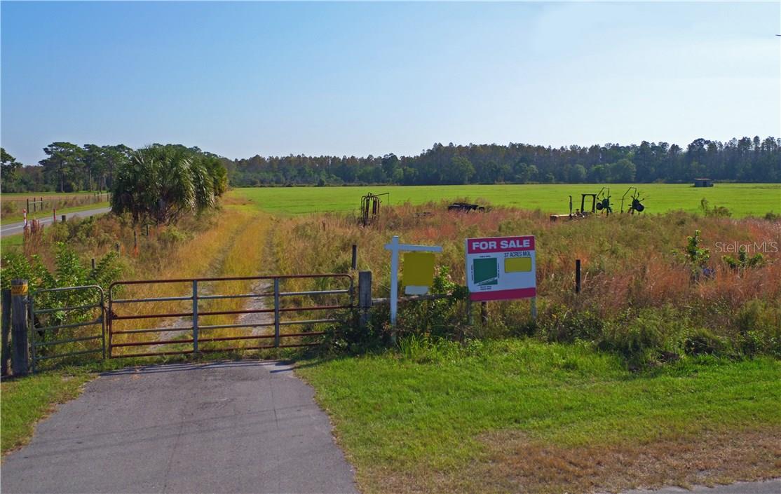 BE SURE TO VIEW THE VIRTUAL TOUR.   Private drive through approx 37 acres in the very heart of the Keystone/Odessa area. This picturesque property is buffered by wooded property to the South and to the East and Keystone Park to the west across Gunn Highway. The perfect parcel for a "one of a kind" family compound or to develop. There is a very large and deep well on the property for the person who would like to plant grove or develop for horses or cattle. This very beautiful and unique parcel is one of just a few large tracts left in the Keystone area. This well located property offers true country atmosphere but is only minutes from shopping and the Citrus Park Mall.