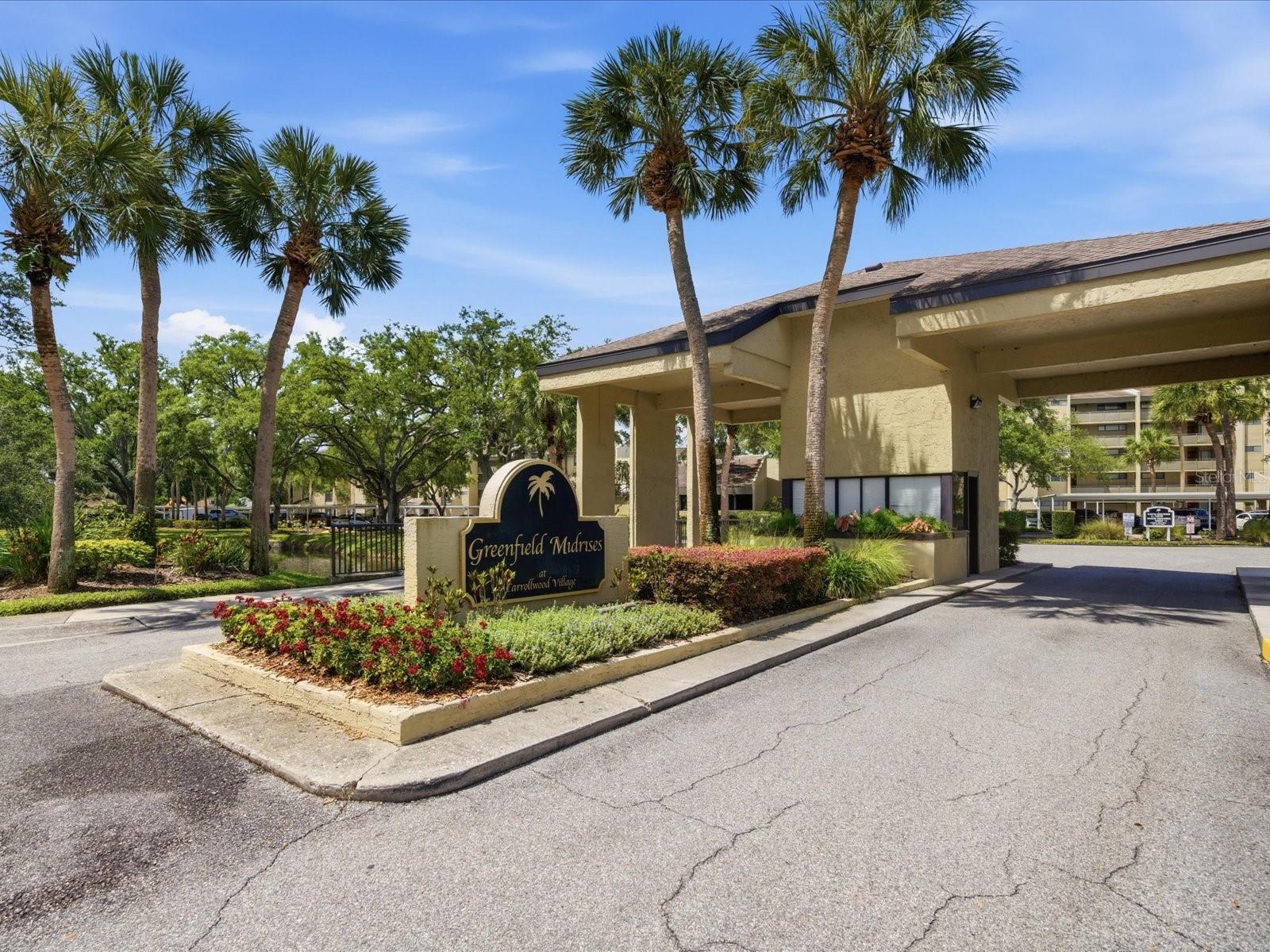 Virtually Staged. We are pleased to present this BEAUTIFUL 2 Bedroom, 2 Bath condominium OVERLOOKING THE CARROLLWOOD COUNTRY CLUB GOLF COURSE in CARROLLWOOD VILLAGE GREENFIELD MIDRISES. Upon entering the property, you will find a home that has been impeccably maintained, and one that features an OPEN AND SPACIOUS, great room floor plan with neutral decor. Additional features include: UPDATED KITCHEN with custom cabinetry and granite counter tops; UPDATED BATHROOM VANITIES; UPDATED FLOORING (no carpet);  a large screened patio with beautiful views; a private laundry room on the same floor; an assigned covered parking space; immaculate condition and more! 
CARROLLWOOD VILLAGE GREENFIELD MIDRISES, featuring a community pool and club house, has LOW HOA FEES that include water, sewer, trash, basic cable, exterior and ELEVATOR maintenance, property manager and more! Add to these a CONVENIENT LOCATION to I-275 and the Veteran's Expressway, Downtown Tampa, Tampa International Airport, parks (including the Carrollwood Village Park with picnic shelters, a dog park, outdoor ping pong tables, walking trails, outdoor fitness equipment, and a skate park and splash park), dining, schools, recreation (including the private Carrollwood Country Club with its 27 holes of Championship Golf, a full-service clubhouse with banquet facilities, a full social calendar, 8 Har-Tru Tennis Courts, and a Jr. Olympic size swimming pool) and medical facilities, and you have a great place to call home!