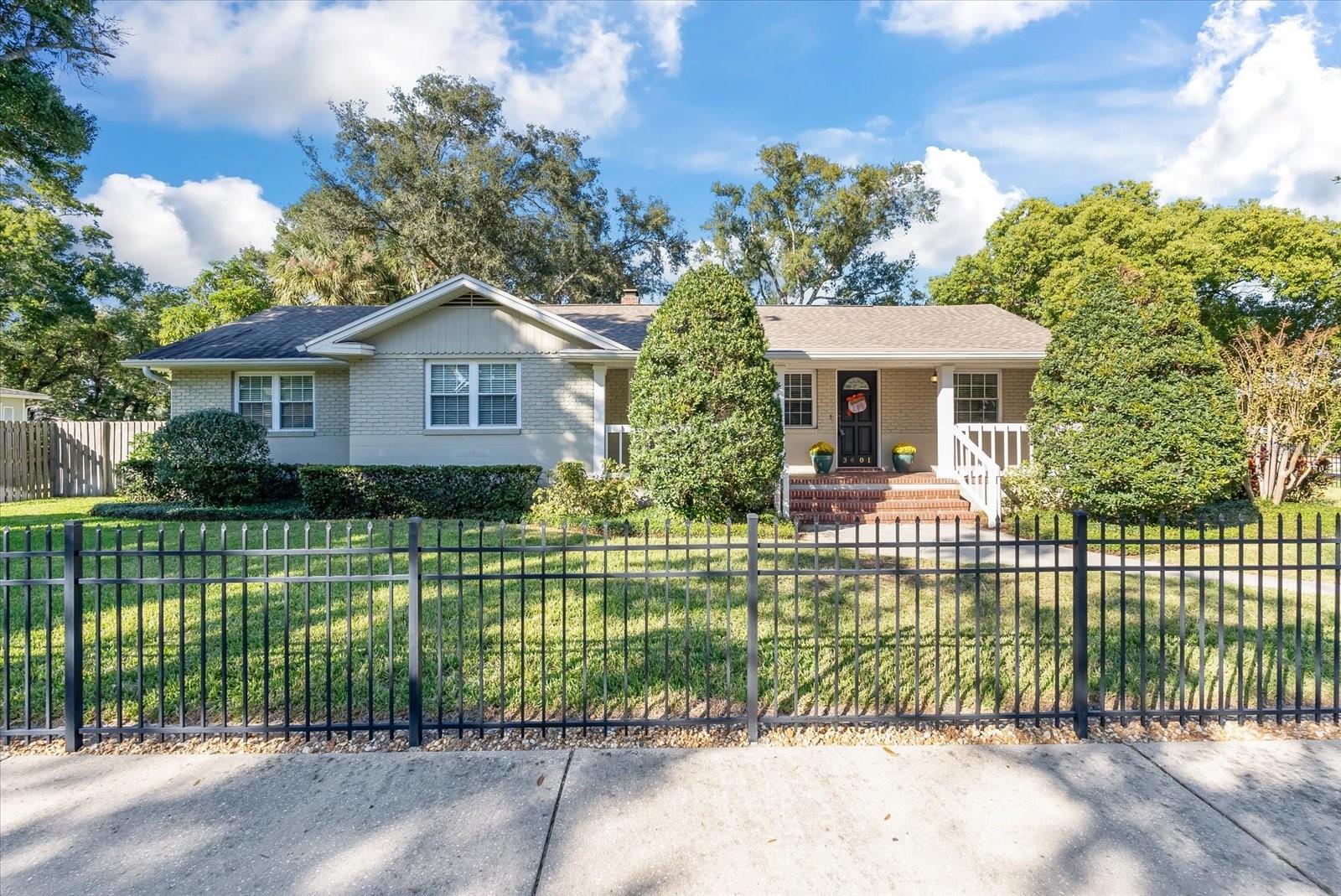 This home is a true South Tampa treasure offering both historical charm and new updates throughout. The spacious 4-bedroom 3.5 bath home is located in the heart of Palma Ceia, sitting on an oversized 109 x 100 fully fenced lot in the exceptional, A-rated Roosevelt/Coleman/Plant school district. Upon entry via the inviting front porch (who doesn’t love a porch swing?) a warm and cozy Formal Living Room leads to a Formal Dining Room with original gleaming hardwood floors and crown moulding which extend seamlessly throughout the home. An updated Kitchen with custom wood cabinets, stainless appliances, breakfast bar and a great mudroom with lots of pantry storage is located off the Dining Room and the newly expanded Family Room. The Family Room encompasses a casual dining area with a wood burning fireplace and adds to the open feel of this timeless home. The thoughtful split plan offers a new Primary Suite with two custom walk-in closets, separate his and her vanities and gorgeous tile inlays in the floor and shower. Three additional bedrooms include a Second Primary Suite with walk in closet and large shower with bench seating (perfect for older visitors or family); Bedrooms 3 and 4 share an updated Jack and Jill Bathroom and both bedrooms have upgraded closets. Upon settling everyone into their new personal spaces, the family can gather on the shady back porch to enjoy friends and entertaining in the lushly landscaped backyard with new no maintenance turf. Additional features include updated plumbing and electric, tankless water heater, water softener and irrigation system. No flood insurance required. Minutes to downtown Tampa, Tampa International Airport and all the dining and shopping that South Tampa has to offer! Call for your personal showing today!