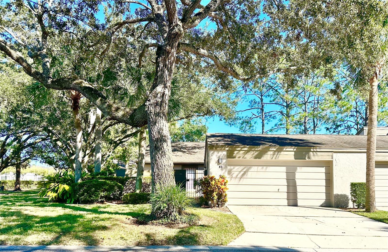 Spacious three bedroom, two bath, end unit - at the front of the community, in the highly desirable Lake of the Woods community in Fern Park.  Newly renovated kitchen with upgraded countertops, glass door cabinets, and newer white appliances to include a new range.  Porcelain tile throughout.  Re-piped in 2021.  Water heater 2017, HVAC 2007.  HOA is responsible for the exterior/roof/ landscaping (except the courtyard area). This home has vaulted ceilings, a huge great room, a two-car garage, a Florida room that can be conditioned space with doors open and a private courtyard. The community includes a lakefront pool, tennis, basketball courts, and a fitness center—a great, convenient location, minutes from I-4 and close to shopping and restaurants.