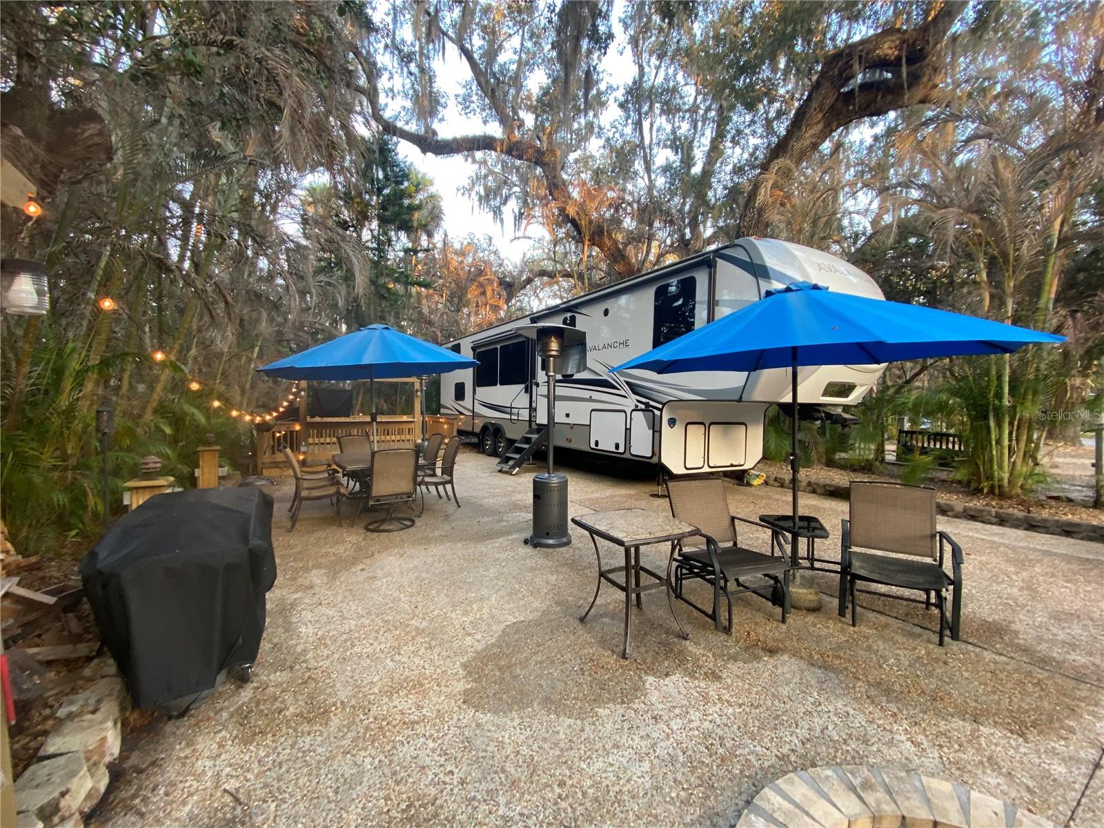 Welcome to 313 Gator Alley in beautiful Lake Wales, located within the highly sought-after River Ranch RV Resort. This exceptional property offers the perfect blend of comfort, community, and classic Old Florida charm.  A magnificent canopy of mature oak trees creates a serene, shaded retreat, providing natural beauty and welcome relief from the Florida sunshine. Whether you’re relaxing outdoors with a morning coffee or hosting friends in the evening, the setting is both peaceful and inviting.  River Ranch RV Resort is known for its outstanding amenities, including multiple sparkling pools and hot tubs, bocce ball, pickle ball, a beautifully appointed clubhouse featuring a fully equipped gym, his-and-hers saunas, a cozy library, media room, card room, billiards, ping-pong, and a spacious gathering hall perfect for social events and activities. The resort fosters an active yet relaxed lifestyle, ideal for seasonal residents or full-time enjoyment.  Just next door, Westgate River Ranch expands your recreational opportunities even further. Enjoy fine dining, exciting weekly rodeos, skeet shooting, a private airfield, and countless outdoor adventures that capture the spirit of the American West—all just moments from your doorstep.  Whether you’re seeking a weekend getaway, winter retreat, or a place to create lasting memories with family and friends, 313 Gator Alley offers a rare opportunity to own a slice of Florida paradise in a truly unique destination.
