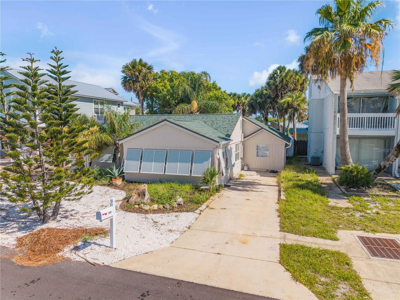Beautifully renovated 3Bd, 2Ba home with a full front enclosed patio and spacious fenced in backyard.  A block to the beach and about 3 blocks to Flagler Ave shopping, dining and entertainment.  This home could be a permanent residence, vacation home or income producing property.