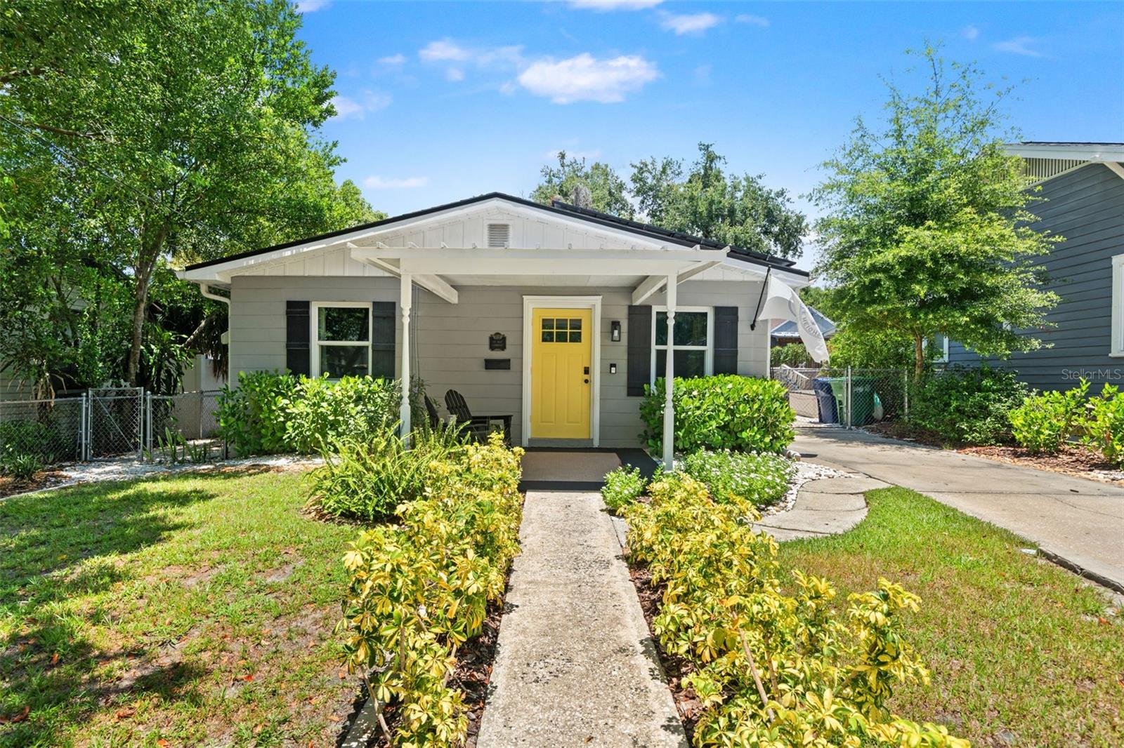 Located in the heart of highly sought-after Old Seminole Heights, this beautifully maintained 3-bedroom, 1-bath block home offers a welcoming floor plan, extensive updates, and an unbeatable location. Just steps from the Hillsborough River and Epps Park, you'll enjoy one of Tampa's most walkable historic neighborhoods with local favorites including Trip's Diner, Gulf Coast Sourdough, Wicked Oak BBQ, and Front Porch just moments away. Inside, natural light fills the spacious living and dining areas, while a built-in workspace is perfect for a home office or workstation. The updated kitchen features shaker-style cabinetry and stainless steel appliances. Through the laundry room you'll find a large screened lanai overlooking the beautifully landscaped backyard with a fire pit, putting green, play area, and plenty of room to relax or entertain. Major updates include a 2021 roof, complete repipe in 2021, 2024 hurricane impact windows, 48-amp Level 2 EV charger, new interior doors installed in 2023, refreshed landscaping, and a solar system that will be paid off by the seller at closing, helping keep electric bills low. Best of all, no flood insurance is required. Conveniently located just 10 minutes from Downtown Tampa with quick access to I-275, Armature Works, and everything Seminole Heights has to offer, this move-in ready home is a rare opportunity to enjoy one of Old Seminole Heights' most desirable locations.