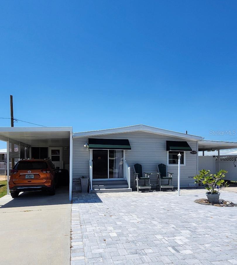 Dive into the good life! Here's your chance to own in a prime location near Sarasota Bay. Lots of upgrades throughout this two Bedroom, two Bath Mobile Home on a Lot & a Half in the highly desired, active 55+ Trailer Estates community. Beautifully updated kitchen with ample cabinet space and newer appliances. Spacious primary Bedroom with huge ensuite Bath and Laundry Room attached. 10x15 Bonus Room is currently used for sewing and crafts, but could be an office or third bedroom. New luxury vinyl flooring. All paver front, and two carports make it so convenient for your golf cart. 8x10 Shed. You own the land. Boaters have direct access to Sarasota Bay from the Marina. Trailer Estates community offers so many options for a great day! Enjoy the large, heated community pool, hot tub, gym and wood shop. The community buzzes with pickleball, shuffleboard, kayaking, horseshoes, bocce, dancing and more. A US Post Office on site. 10 minutes to the SRQ Airport. Convenient to shopping, restaurants, the Arts and everything in Bradenton/Sarasota. Bring offers!