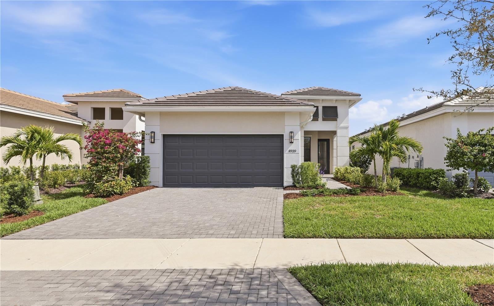 Welcome to effortless Florida living in the highly desirable Cresswind at Lakewood Ranch community. This beautifully designed 2024-built home offers modern style, comfort, and low-maintenance living in one of the nation’s top master-planned communities, Lakewood Ranch.
This thoughtfully designed single-family home features approximately 1,852 square feet, with 2 bedrooms, 2 bathrooms, 1 bonus room, and a bright open-concept floor plan ideal for both everyday living and entertaining. The spacious great room is upgraded with modern custom built-in cabinetry. The great room flows seamlessly into the dining area and kitchen, creating a welcoming environment for gatherings with family and friends. Large windows allow natural light to fill the home, enhancing the airy Florida lifestyle buyers love.
The modern kitchen offers generous counter space, stylish cabinetry, and an efficient layout that keeps the chef connected to the main living areas. The private primary suite provides a relaxing retreat with a spacious bedroom, well-appointed bathroom, and walk-in closet. A comfortable guest bedroom and second full bath offer privacy and convenience for visiting family and friends.
Enjoy the Florida outdoor lifestyle with inviting outdoor space perfect for morning coffee or relaxing evenings. The manageable homesite provides easy maintenance so you can spend more time enjoying the community.
Cresswind at Lakewood Ranch is an active lifestyle community featuring resort-style amenities, including a clubhouse, fitness center, pickleball and tennis courts, walking trails, and a full calendar of social events. Conveniently located near Lakewood Ranch shopping, dining, golf courses, medical facilities, and Sarasota’s world-famous Gulf Coast beaches, this home offers the best of Bradenton and Lakewood Ranch real estate living.
Discover why so many buyers are choosing Lakewood Ranch homes for sale as their next move.