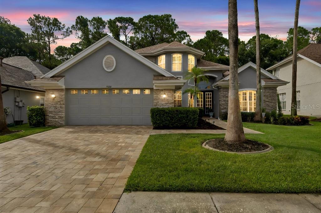 Discover luxury living in the Greens, a 24-hour GATED neighborhood in the Heart of Westchase! This stunning 4-bedroom plus office, 3-bathroom home features tons of upgrades, a gourmet kitchen with gas range, beautiful gray cabinets, oversized island, gleaming granite countertops, stainless steel appliances, and a spacious pantry, following effortlessly into the family room, ideal for entertainment. The grand entryway opens into a formal living and dining room + office (can be used as a 5th bedroom if needed) The family room showcases high ceilings, impressive wall niches with built in shelves, wood staircases connecting to the fourth bedroom upstairs and a triple slider that opens to the pool. A spacious master suite offers gorgeous views of the conservation area. The stunning master bathroom has been completely remodeled with porcelain tile, a custom seamless glass shower with an elegant and modern soaked tub and a beautiful double custom vanity. The second and third bedrooms are in a separate wing of the home with an adjacent remodeled bathroom. Escape to your outdoor oasis with a NEWER pool, recently installed pool tiles and pool surface, new pool pump, Roof installed in 2020, water softener, home intercom system and Built-in in-home sound system. Conveniently located within less than 30 minutes from the beaches, 15 minutes from Tampa international airport, and a convenient commute to downtown Tampa.