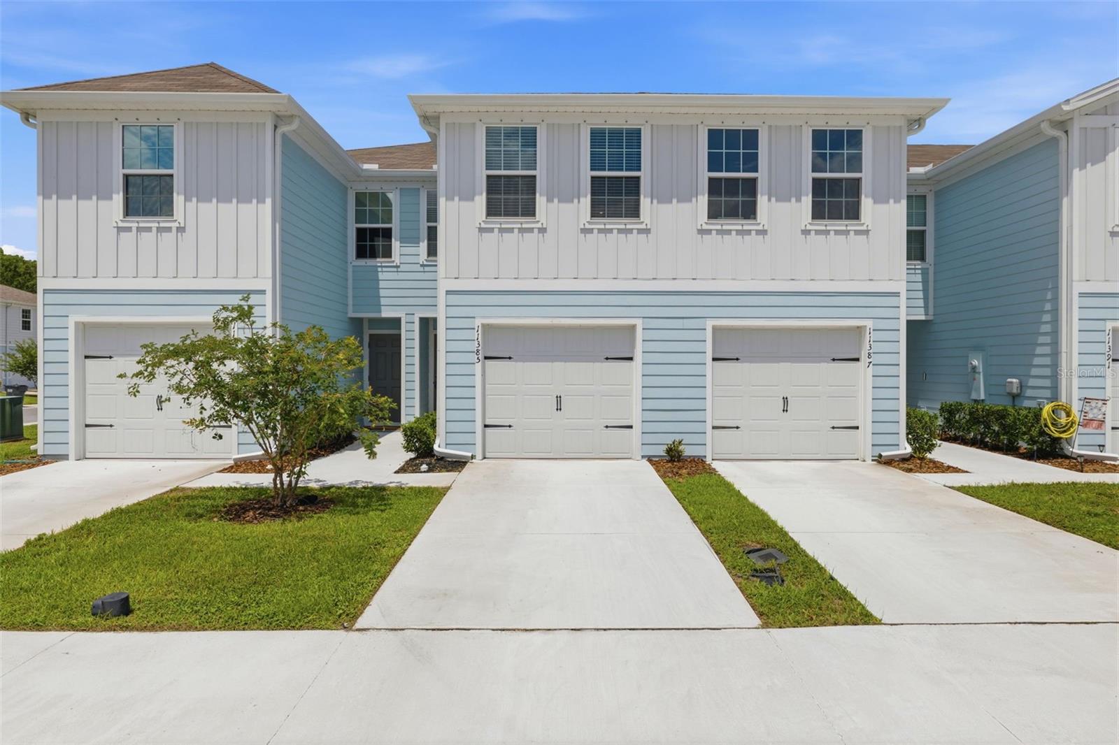 Built in 2025 and better than the day it was delivered - this stunning Bear Creek townhome checks every box for low-maintenance Florida living done right. The Flamingo floorplan offers 1,440 square feet of smart, open-concept space with 3 bedrooms, 2.5 baths, and a 1-car garage, all wrapped in the kind of quality and finish level that newer construction buyers expect. Inside, granite countertops, a kitchen island, stainless steel appliances, and upgraded fixtures and fan give the space a polished, move-in-ready feel. The owner's suite features double sinks, and the washer and dryer convey - nothing left to do but unpack. Step outside to the newly screened-in lanai, a perfect spot for morning coffee or evening unwinding without the Florida bugs. The community HOA covers exterior maintenance, cable TV, and high-speed internet - no CDD, incredible value. WiFi-enabled garage opener and Ecobee smart thermostat included. Located in the heart of New Port Richey, you're minutes from shopping, dining, parks, and some of Florida's most beautiful Gulf Coast beaches. Whether you're looking for a primary residence, a winter retreat, or a turn-key investment, this one is truly move-in ready.