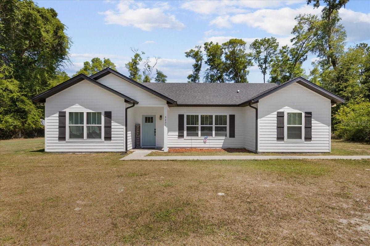 Welcome to the gorgeous Spanish Trace Subdivision located in the countryside of Chiefland Fl. Known for its abundant wildlife presence and being secluded and private. This custom 2022 site built home offers an open floor plan, 3 bedrooms/2 bathrooms with an awesome flex room (currently a nursery) that can be used as an office or anything you need. As you enter the home you are greeted with the wide open floor plan, gorgeous tall cathedral ceilings. A kitchen filled with beautiful cabinetry and quartz countertops. A large space for dining with plenty of room for an oversized table. A true split floor plan, with Flex room and master bedroom on one side. Oversized master bedroom with tray ceiling , walk in closet and spacious bathroom with garden tub and walk in shower. Two guest bedrooms on the other side of the home, guest bathroom and a spacious washer and dryer. You have one beautiful acre partially surrounded by pines and Florida hardwoods offering privacy and seclusion. This home is the perfect starter home, perfect retirement home and perfect final home. Accepting ALL loans, call today for YOUR tour!