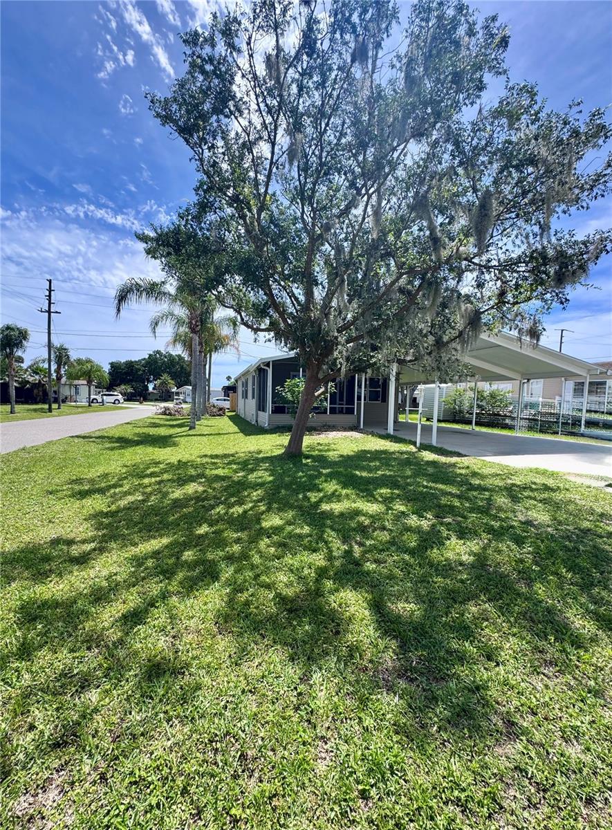 Welcome to this beautifully-maintained home located in a quiet neighborhood in Edgewater, Florida. This 2-bedroom, 2-bathroom property offers a comfortable and functional layout with spacious living and dining areas. The highlights of the home are the large screened-in room— with brand new sliding glass doors, perfect for relaxing, entertaining, or enjoying Florida’s beautiful weather bug-free year-round and the oversized corner lot! The kitchen features ample cabinet space and flows seamlessly into the main living areas. Both bedrooms are generously sized, and the primary suite includes an en-suite bath for added privacy. Outside, enjoy a nicely sized yard with plenty of room for gardening or outdoor activities. Located in the tranquil community of Terra Mar Village, residents enjoy exceptional amenities and a strong sense of community. The neighborhood offers two 40,000-gallon saline swimming pools, one of which is heated year-round, and a private 300-foot fishing pier along the scenic Florida Intracoastal Waterway. Outdoor enthusiasts will appreciate the shuffleboard, bocce ball, and horseshoe courts, while the large brick clubhouse is perfect for social gatherings and community events held throughout the year. Boating enthusiasts will love the newly constructed secure marina with covered boat lifts and slips, offering easy access to the Intracoastal Waterway (slip leases are currently available). A convenient community boat launch makes it easy to start your water adventures. Additionally, affordable on-site RV and trailer storage is available for a minimal monthly fee. Terra Mar Village provides a perfect balance of recreation, relaxation, and community, making it ideal for families or anyone seeking a peaceful yet active lifestyle.
