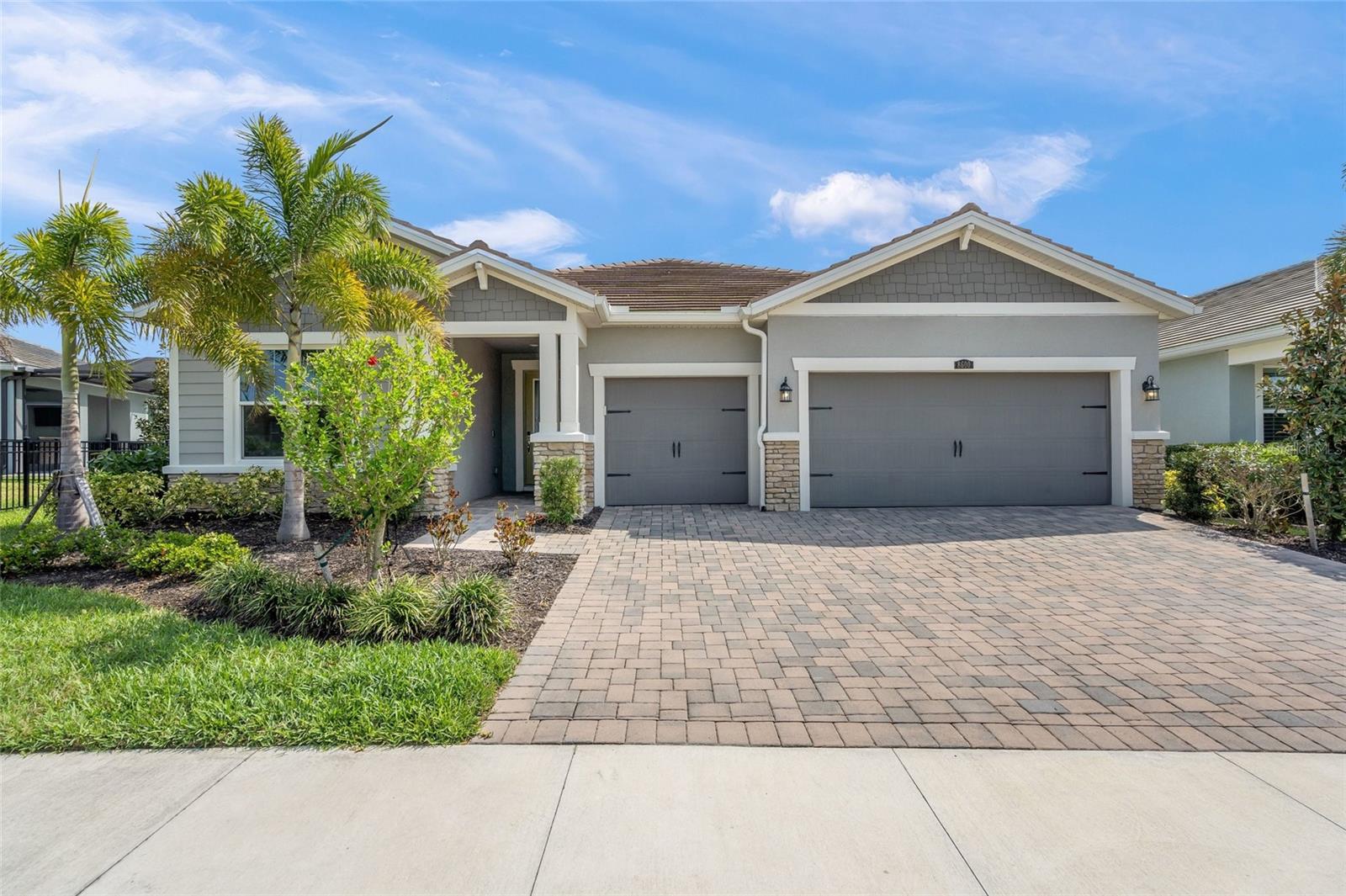 Welcome to your dream home in the highly desirable Sunrise Preserve at Palmer Ranch. This beautifully maintained, newer residence offers a versatile, open floor plan thoughtfully designed for both comfort and style. Featuring 3 bedrooms, 3 full bathrooms, a spacious office/den, and a 3 Car Garage, this home is ideal for everyday living and effortless entertaining.  Proudly offered by its original owner, this seasonally used home has been impeccably cared for and includes HURRICANE IMPACT WINDOWS & SLIDERS, a decorative impact glass front door, and custom window treatments throughout—combining style, comfort, and peace of mind. Step inside to discover elegant tile flooring that flows seamlessly through the main living areas and den/office, complemented by a neutral palette ready for your personal touch. The smart split-bedroom layout provides privacy, with an en-suite guest bedroom at the front of the home, along with a welcoming office/den space. The office is equipped with door window shades, allowing it to easily function as a fourth bedroom when needed.  At the heart of the home, the open-concept living area features a built-in wet bar and a chef-inspired kitchen complete with a glass tile backsplash, walk-in pantry, and a large center island—perfect for casual mornings or hosting gatherings. The kitchen and dining areas overlook the expansive family room, where wall-to-wall sliders open to a screened lanai, revealing a spacious backyard and tranquil preserve views.  A secondary bedroom and full bath are conveniently located off the main living area, while the private primary suite is tucked away at the rear of the home. This serene retreat showcases a tray ceiling, oversized walk-in closet, and a luxurious en-suite bath with dual vanities and an oversized walk-in shower with dual shower heads.  With no rear neighbors, you’ll enjoy exceptional privacy and peaceful preserve views—perfect for taking in stunning sunrise mornings. Additional highlights include an oversized three-car garage with epoxy flooring for durability and easy maintenance.  The low monthly HOA fee covers grounds maintenance, irrigation, and access to Sunrise Preserve’s outstanding amenities, including a resort-style pool, clubhouse, tennis, pickleball, bocce ball courts, and more.  Ideally located near shopping, dining, beautiful Gulf beaches, and I-75—and situated within an excellent school district—this home truly offers the best of Florida living. Don’t miss your opportunity to make it yours!