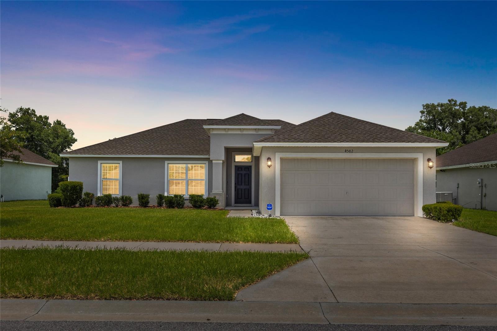 Welcome home to Gresham Farms, a desirable gated community conveniently located near I-4, Lakeland Linder International Airport, and Publix, offering both comfort and convenience.  This beautiful 3-bedroom, 2-bath home is only 3 years old and features a spacious open floor plan designed for everyday living and entertaining. The heart of the home is the oversized kitchen, complete with abundant cabinetry, generous counter space, and a cozy breakfast nook—perfect for morning coffee or casual meals.  The vaulted ceilings enhance the bright and airy dining and family room combination, creating an inviting space for gathering with family and friends. A convenient inside laundry room includes a commercial-grade GE washer and dryer, making move-in even easier.  Retreat to the spacious primary suite, offering a huge walk-in closet, dual vanities, and a generously sized walk-in shower. Two additional bedrooms provide flexibility for family, guests, or a home office.
Step outside to enjoy the large, fenced backyard, where peaceful wooded views create the perfect backdrop for relaxing, entertaining, or simply enjoying nature. Additional features include a 2-car garage with attic access for extra storage.  If you’re looking for a home that combines space, privacy, and an excellent location, this Gresham Farms gem is one you don't want to miss!  One very important bonus with this home is that everything you need is already here-the home is being sold fully furnished, absolutely free!  Each room comes complete with furnishings and essential household items, offering the ultimate turnkey living experience.  The furniture is less than a year old, and has barely been used-some pieces have never been used at all.  All wall decor and planters included as well.  You won’t be disappointed!  Schedule your showing today!
