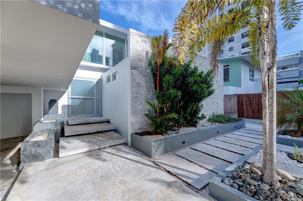 Tastefully redesigned from the ground up in 2017, this architecturally contemporary residence highlights the luxury of open floor plan living in one of the few redone single family homes located in Condado Beach. Polished terrazzo floors throughout seamlessly integrate with the floor to ceiling glass doors that open directly to the abundantly lush backyard. With just about a ¼ acre of property, 11 Manuel Rodriguez Sierra offers eastern exposure, capturing the beautiful morning light, and affording the much needed afternoon shade. 3 Bedrooms with baths on suite stretch across the second floor, as well as a full floor length outdoor terrace, interconnecting all suites to the outdoors. Kitchen with separate galley kitchen and bar, maids suite with full bath, mud room, living, dining and den , on ground floor.

The grounds offer a 4 car gated parking area, with private walk entrance from street, inground outdoor pool, sunning areas with deck , outdoor summer kitchen, sun sails to capture the comfort of outdoor living, and multiple terraces to round out this rare to find Condado Beach Home. ½ a block from the sand and sitting in the pulse of the community.

Currently tenant occupied. Available for appointment with a 48hr notice.