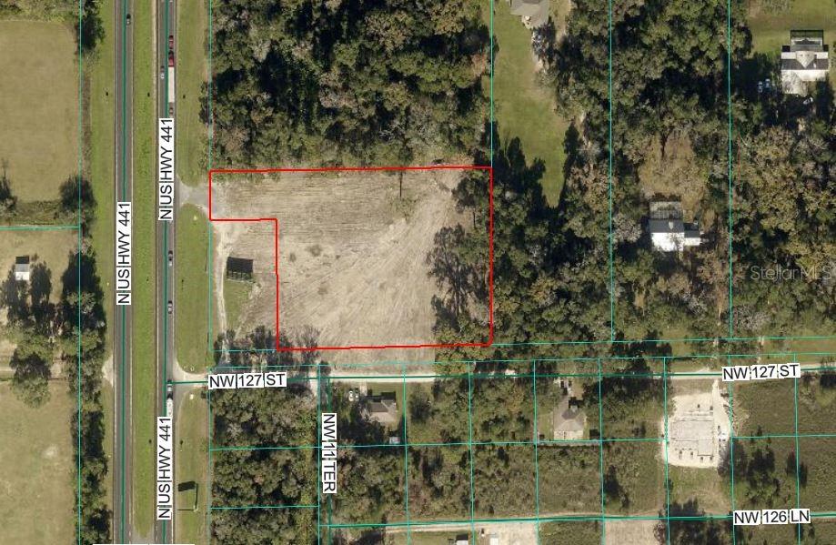 Position your business for success on this high and dry commercially zoned B-4 property with prime frontage on busy US 441 between Ocala and Gainesville. Located near established fuel stations and a signalized intersection, this cleared site offers outstanding visibility and convenient access for customers traveling the corridor. Property has 175 ft frontage on 441/301 four Lane before the Gainesville and Jacksonville routes.  2.65 Acres just south of Intersection with 329.   Property has frontage on NW 127th Street as well.   Heavily traffic route from Ocala to Gainesville and Jacksonville.   Priced to sell offers considered.   Commercial zoned.  Billboard on corner owned by others.   Let us know your use and how this site is your ideal location!  Property recently chain link fenced.  Ideal location just before the 441 / 301 split to Gainesville and Jacksonville.  15 minutes north of Ocala.   Drive by today.