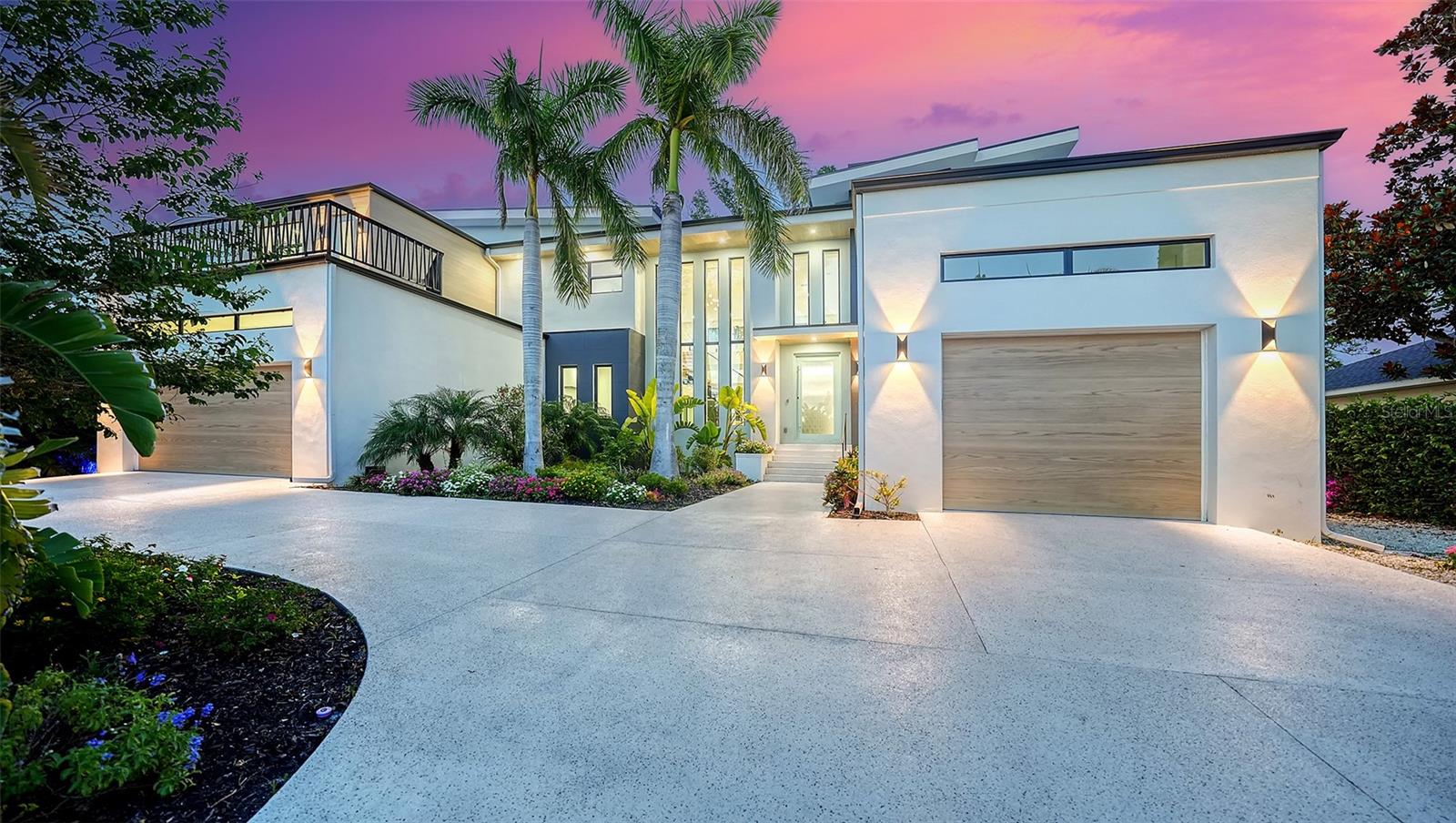 One or more photo(s) has been virtually staged. LOWEST PRICED NEW CONSTRUCTION WEST OF TRAIL HOSPITAL/SOUTHSIDE VILLAGE AREA! Truly a Coastal Classic Modern Masterpiece Located in One of the MOST Sought After Neighborhoods West of the Trail in Sarasota! This Gorgeous HARBOR ACRES Home is NOT your Typical Very Traditional Boring Florida Home! This Home was Built for the Discerning Buyer who Appreciates Modern Art and Design! Every Room is Unique and Designed with Attention to Detail and Gracefully Incorporates the Outside Indoors via Walls with Large Picture Windows. This Amazing Property Features: A MAIN HOUSE w/5 Bedrooms, 5.5 Baths, 2 Master Suites (Up & Down) both w/Zen-like 5-Piece Master Baths w/Whirlpool Soaking Tubs and Separate Showers; Fabulous Great Room w/Soaring Ceilings, Wall Fireplace and Sliders Looking Out to the Aqua Pool and Spa and Tropical Landscape; Extra Flex Room off Kitchen w/Built in Art Niche makes a Perfect Dining Room, Den/Office w/Built-ins, Fabulous Kitchen w/Separate Refrigerator, Freezer & Wine Refrigerator, Luxury Dacor Appliances, Quartz Counters, Designer Kitchen Cabinetry, Pantry, Eating Bar; Media Bonus Room w/Balcony, Laundry Room w/Storage, Open Glass Staircase to Upstairs, Elevator Shaft to All Floors, Porcelain Tile and Elegant Lighting Fixtures throughout, Bosch AC Units, 2 Balconies Upstairs, En-Suite Bedrooms, Powder Room w/Glass Art Sink, Impact Windows and Sliders w/Low E Glass, Oversized 2 Car Garage and an Oversized 1 Car Garage w/Electric Charging Stations, Smart Home w/Fully Integrated Wifi System, Covered Lanai w/Fully Equipped Out Door Kitchen and Fire Pit. A Detached CASITA GUEST HOUSE w/Separate Entrance, Full Bath, Kitchenette and One Bedroom overlooking the Pool Court Yard, Perfect for a Nanny, House Keeper, Teen, MIL or Pool Party Room. The Outdoor Features: Gorgeous 35 Foot Saltwater Pool w/Waterfall, Huge Sun Shelf and Hot Tub Spa; Lush Tropical Landscaping, Tiered Flower Planters, Low Maintenance Yard, Irrigation, Circular Driveway and Privacy Wall. Home was Built nearly 2 FT above the Flood Zone and does NOT Require Flood Insurance. This Never Before Been Lived in Home is Ready and Waiting for It's New Owner! Located just Minutes to Sarasota Memorial Hospital and Medical Center, Morton's Market, Downtown Sarasota, Shopping, Dining, St Armand's and the Best Beaches!