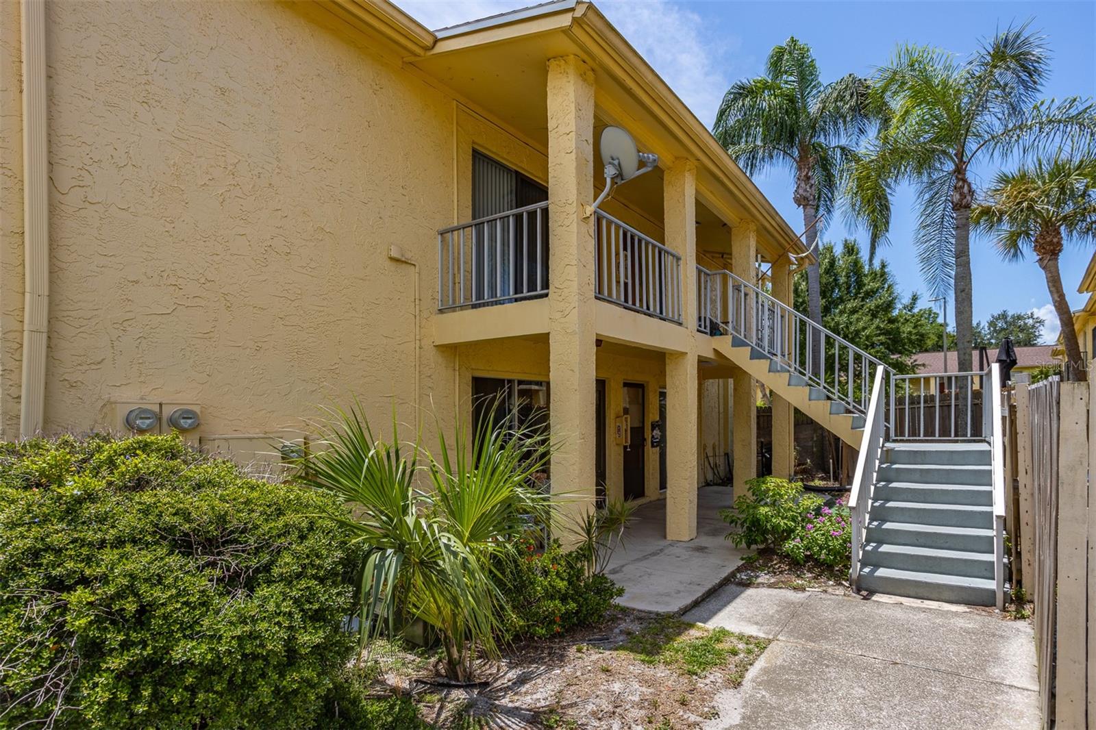 Welcome home to this beautifully updated, move-in ready second-floor condo in the desirable Greens of Town & Country community. This charming 1-bedroom, 1-bath end unit is the perfect opportunity for first-time buyers, seasonal residents, or investors looking for a low-maintenance property in a prime Tampa location.

Inside, you'll find an open and inviting living and dining area with durable laminate flooring that creates a warm, modern feel. The kitchen offers plenty of cabinet space, a generous walk-in pantry, and features a newer stove and refrigerator, making it ready for everyday living from day one. The spacious bedroom includes an oversized walk-in closet and provides exceptional storage. 

Residents of The Greens of Town & Country enjoy access to fantastic community amenities, including two swimming pools, a tennis court, clubhouse, beautifully maintained grounds, and ample guest parking. This unit also includes its own assigned parking space, with the community laundry facility conveniently located just steps from the front door.

Ideally situated just minutes from Tampa International Airport, major highways, shopping, dining, and some of the area's best beaches, this condo offers the perfect combination of comfort, convenience, and affordability. With low monthly HOA dues and nothing left to do but move in, this is a fantastic opportunity to own a turnkey home in the heart of Tampa. Schedule your private showing today!