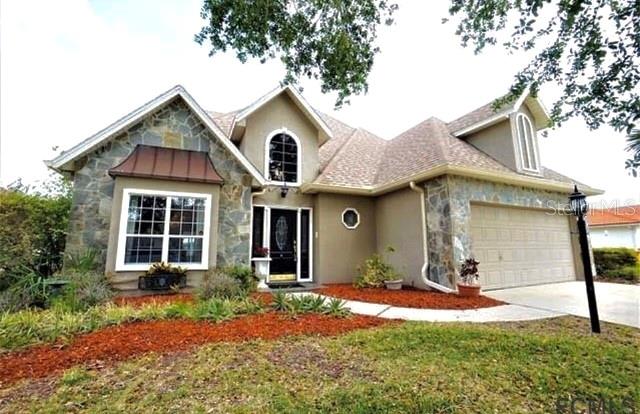 No expense has been spared on this beautifully remodeled waterfront home. From the stunning hard wood floors throughout ,tiled foyer, and elegant chandeliers.
This saltwater canal home is located in the heart of Palm Coast's sailboat country with easy access to the Intracoastal Waterway . A new pool and dock are just a few of the additional upgrades make this a one of a kind home.

An elegant foyer introduces the home's personality and welcomes your guests.  Stunning Formal dining for those special occasions. 
Gourmet Kitchen, for professional and aspiring chefs alike, and for all who desire luxury cooking environments, you've come to the right place.
 Incredible ,spacious Florida Room with sitting room dining area, wet bar, two built in  wine coolers and a retractable projection screen TV .Perfect for entertaining 
1st floor master suite with and attached sitting room overlooking the canal for a quiet place to take in the canal views. 
Large second floor includes  2 bedrooms with builtin bookcases .and a sitting area looking over the living room .
bedrooms.  
This is what waterfront living is all about !  A must see for sure ! ;Water: City