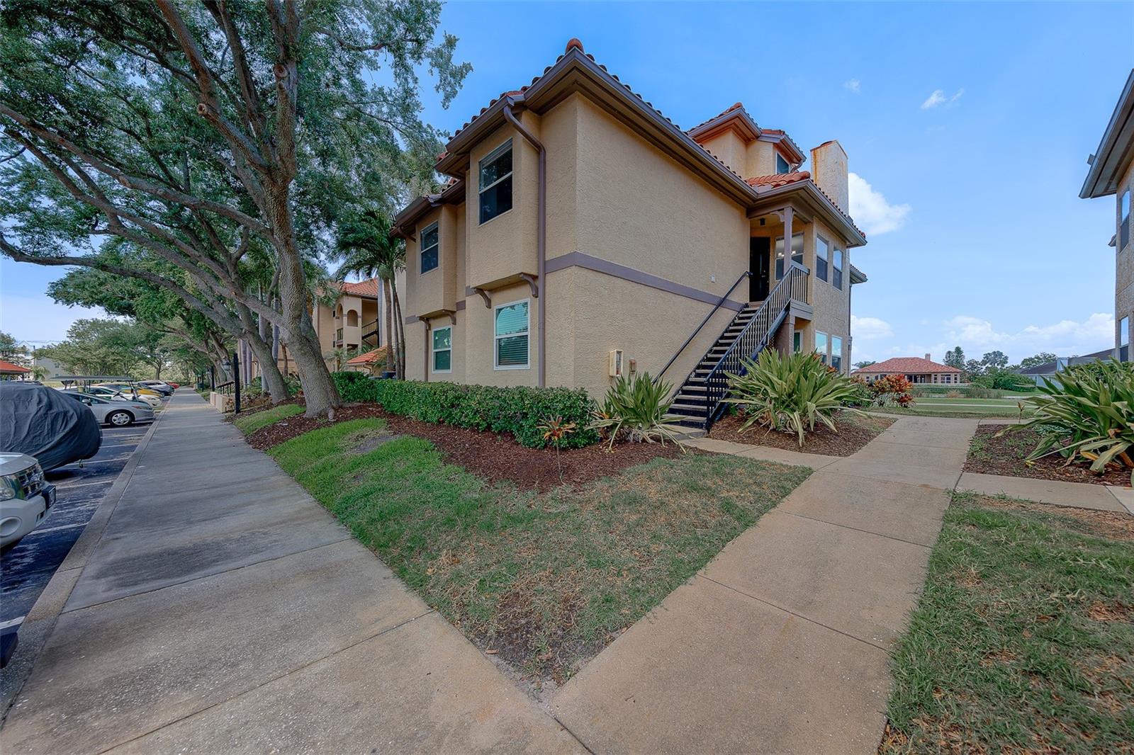 Welcome to this beautifully updated and move-in ready 2-bedroom, 2-bath condo offering 1,037 sq. ft. of comfortable living in the highly desirable Audubon Condominiums at Feather Sound. Perfectly positioned in one of Tampa Bay’s premier golf communities, this home combines peaceful golf course views, modern updates, and an unbeatable central location.

A private entrance welcomes you into this light and bright condo featuring fresh interior paint, luxury vinyl plank (LVP) flooring, and tile in all the right places for durability and easy maintenance. The thoughtfully designed split-bedroom floor plan offers added privacy, while the open-concept living and dining areas create an inviting space ideal for both everyday living and entertaining. A cozy fireplace serves as the focal point of the living room, adding warmth and charm to the home's welcoming atmosphere.

Step onto the screened-in porch and enjoy breathtaking, unobstructed views of the Feather Sound Golf Course and tranquil creek below. Whether enjoying morning coffee or relaxing at sunset, this outdoor space offers a true Florida lifestyle experience surrounded by lush greenery and nature.

The kitchen and living spaces provide a clean, refreshed aesthetic ready for your personal style. Both bedrooms are generously sized, with the primary suite featuring a private en-suite bath and ample closet space.

Located within the gated Audubon Condominiums at Feather Sound, residents enjoy access to resort-style amenities including:

• Resort-style swimming pool and spa
• Large fitness center
• Tennis and pickleball courts
• Indoor basketball court
• Clubhouse with workspace and social areas
• Car wash and vacuum station
• Secure gated entry with guard

Feather Sound is one of Tampa Bay’s most sought-after communities, known for its beautifully maintained surroundings, scenic walking trails, parks, and convenient location between Tampa and St. Petersburg. Residents enjoy over three miles of sidewalks perfect for walking, jogging, and biking.

Golf enthusiasts will appreciate being located on Feather Sound Country Club, consistently recognized among Tampa Bay’s Top 5 private golf courses, offering premier golf, dining, and social opportunities just moments away. Topgolf is also nearby for additional entertainment and recreation.

This prime location provides quick access to Downtown Tampa, Downtown St. Petersburg, Tampa International Airport, and St. Pete–Clearwater International Airport. Enjoy close proximity to shopping, dining, entertainment, and Florida’s award-winning Gulf beaches, all while being just over an hour from Orlando attractions.

Whether you are searching for a primary residence, seasonal getaway, or investment opportunity, this move-in ready condo offers the perfect blend of comfort, convenience, lifestyle, and location in the heart of Tampa Bay.

Seller has priced the property based on current market conditions and the condition of the home, presenting an excellent opportunity to own in the highly desirable Feather Sound community