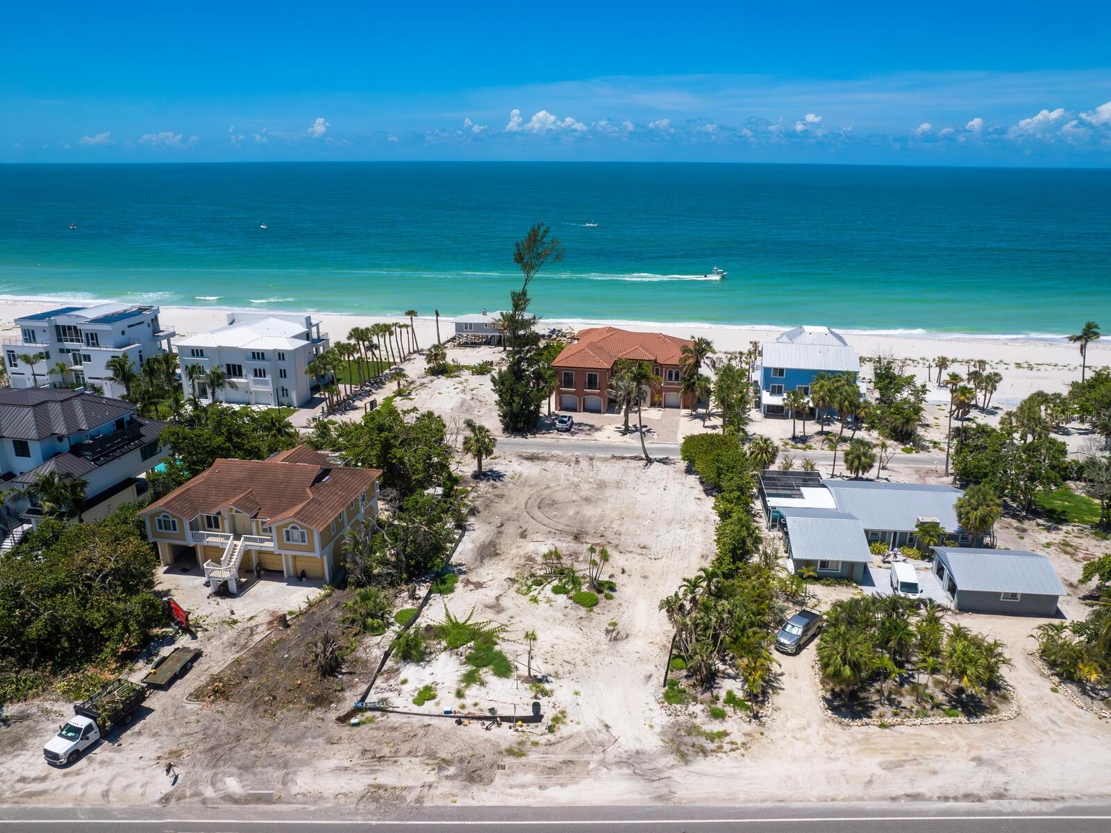 Flanked by multi-million-dollar homes, uniquely situated on the West side of Gulf of Mexico Dr with no busy street between you and the beach! Lot is cleared and ready with utilities at the lot. Build your dream home on this large lot (16,000 sq ft) just steps from the sugar sand beach on beautiful Longboat Key on the Gulf.  This lot has the added bonus of backing up to Gulfside Road with a very short walk to beach access at the end of the street.  Longboat Key is a barrier island situated off the Gulf Coast of Florida and has so much to offer — beach, boating, tennis, pickleball, cycling and more.  Fly straight into Sarasota airport and enjoy quick access to Longboat Key, Anna Maria Island, St. Armands Circle, downtown Sarasota and the University Town Center.